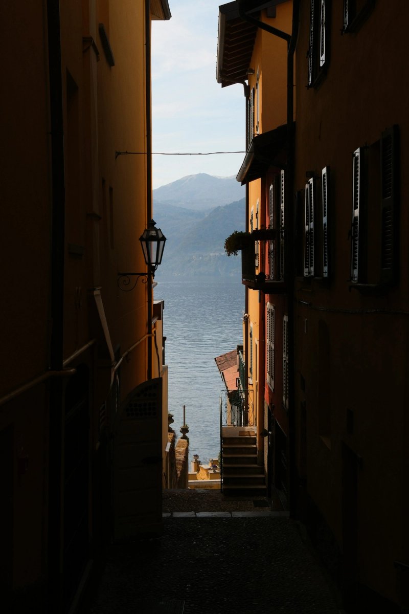 Narrow alley in Varenna leading to a beautiful Lake Como view
