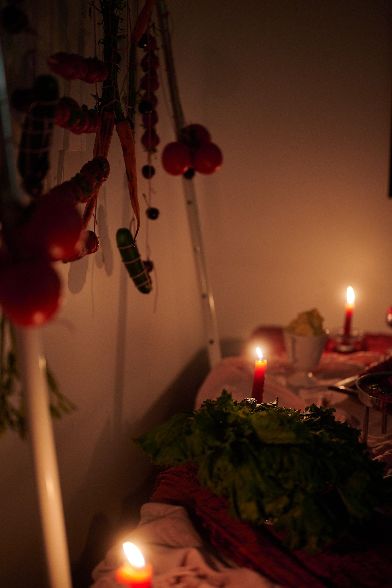 Shibari fruit display with candles