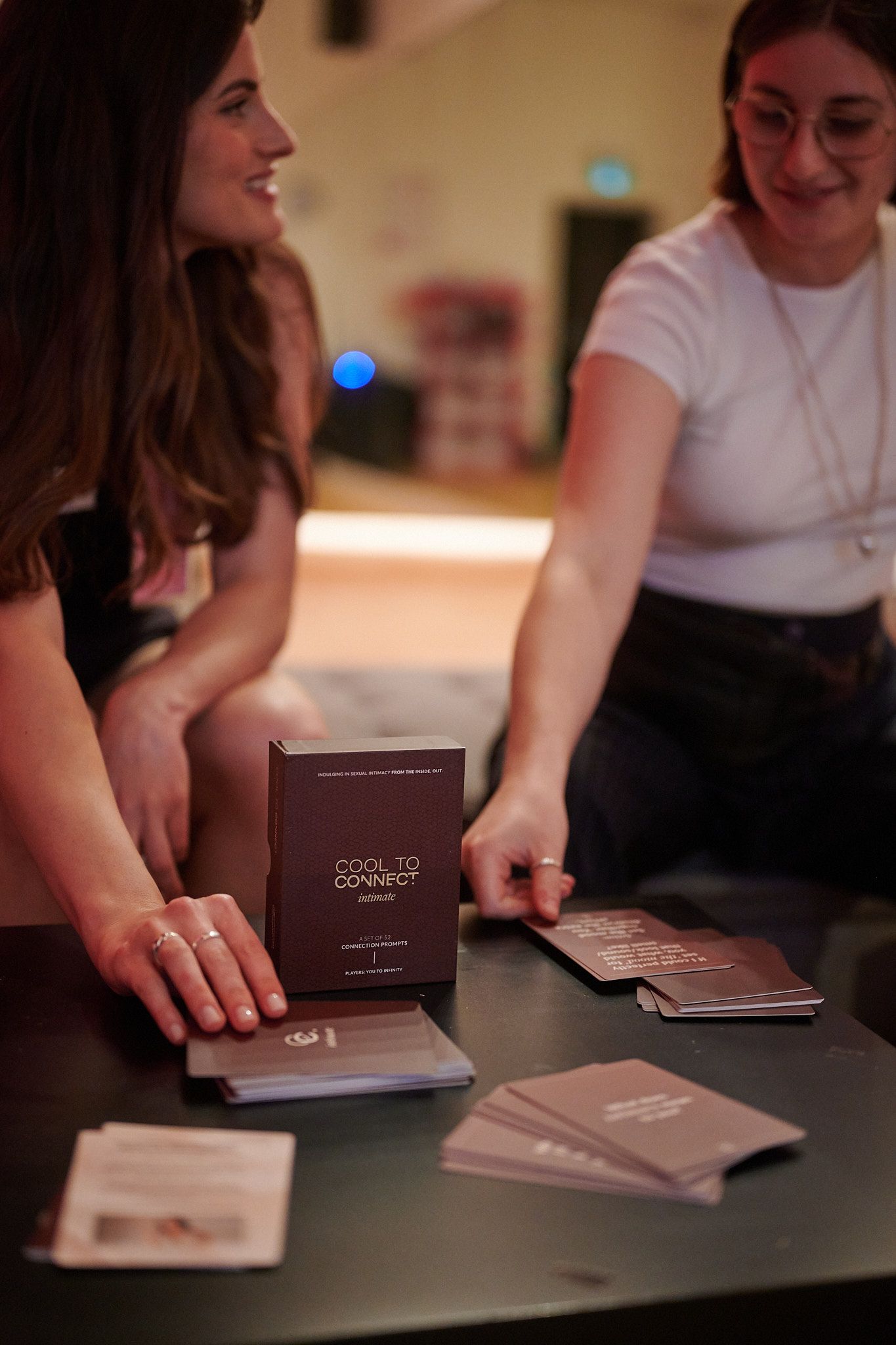Two girls playing card game