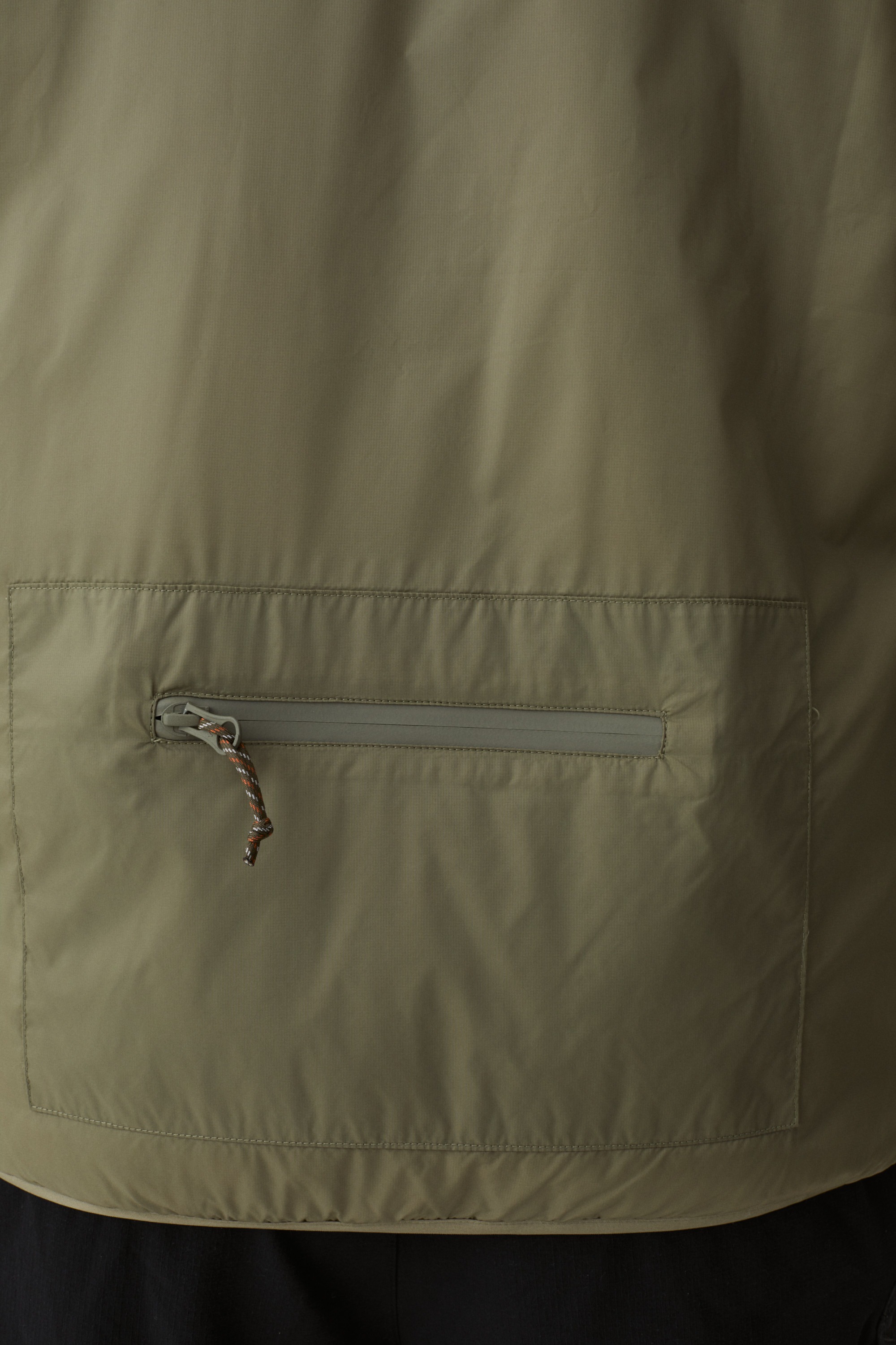 Model wearing Yama Traverse Plain Vest Moss Green