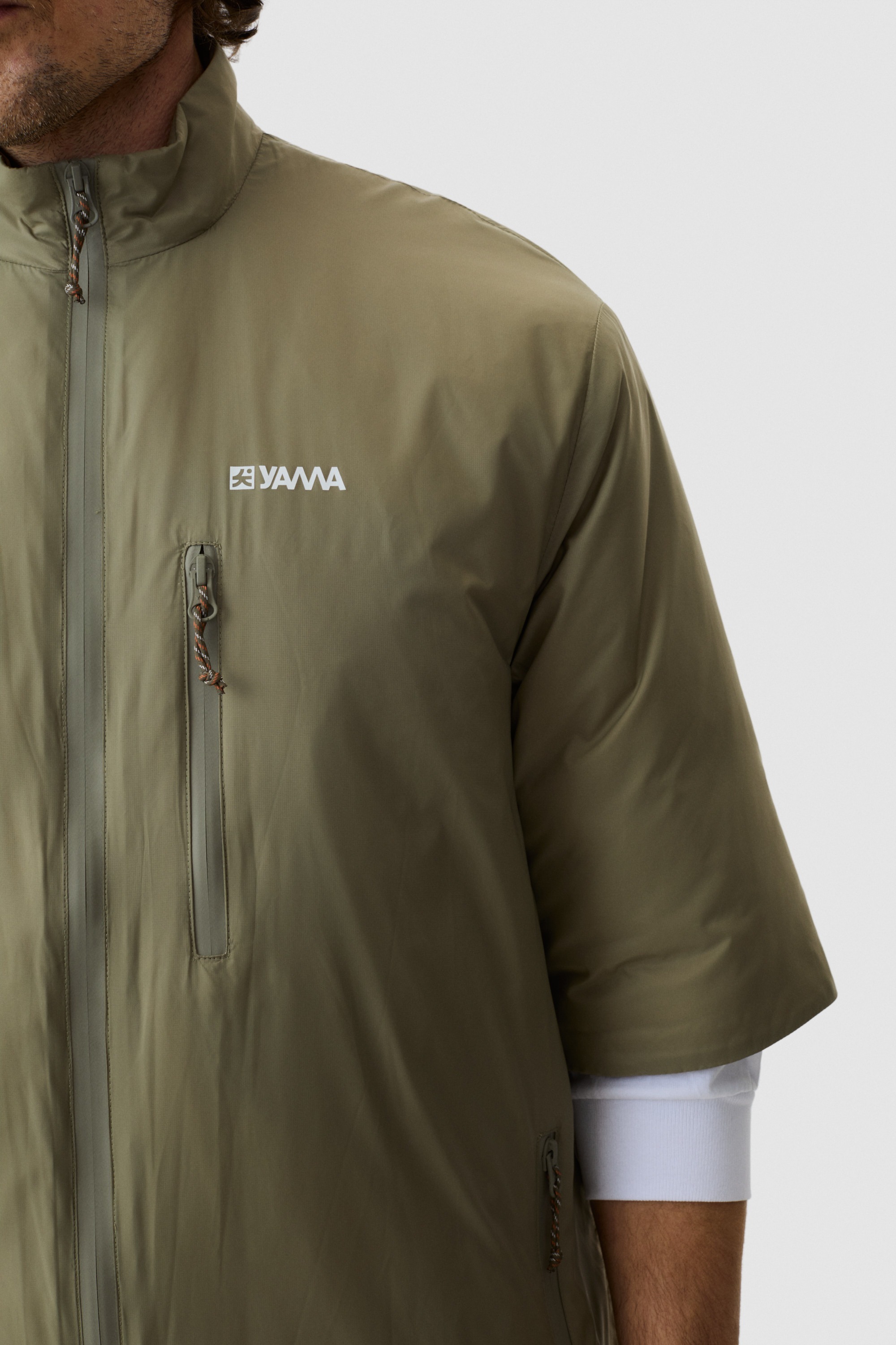 Model wearing Yama Strata Plain Jacket Moss Green