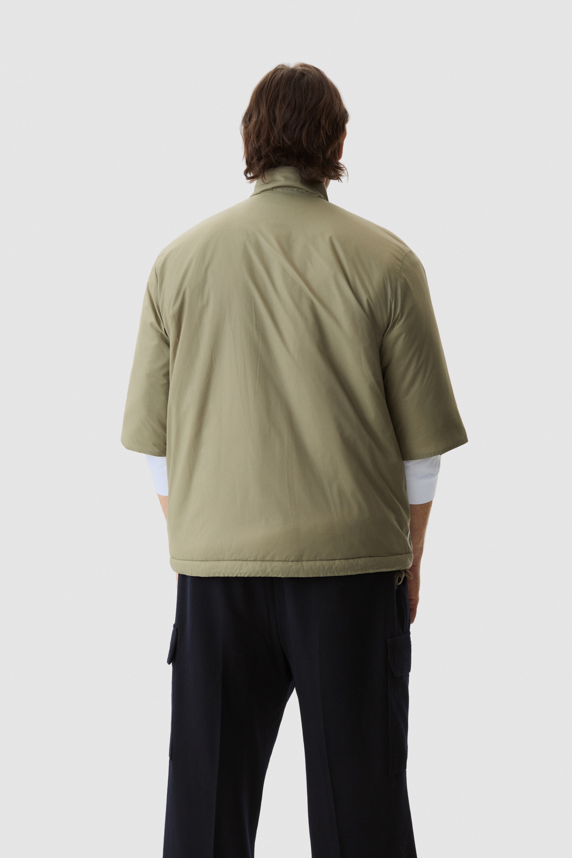 Model wearing Yama Strata Plain Jacket Moss Green