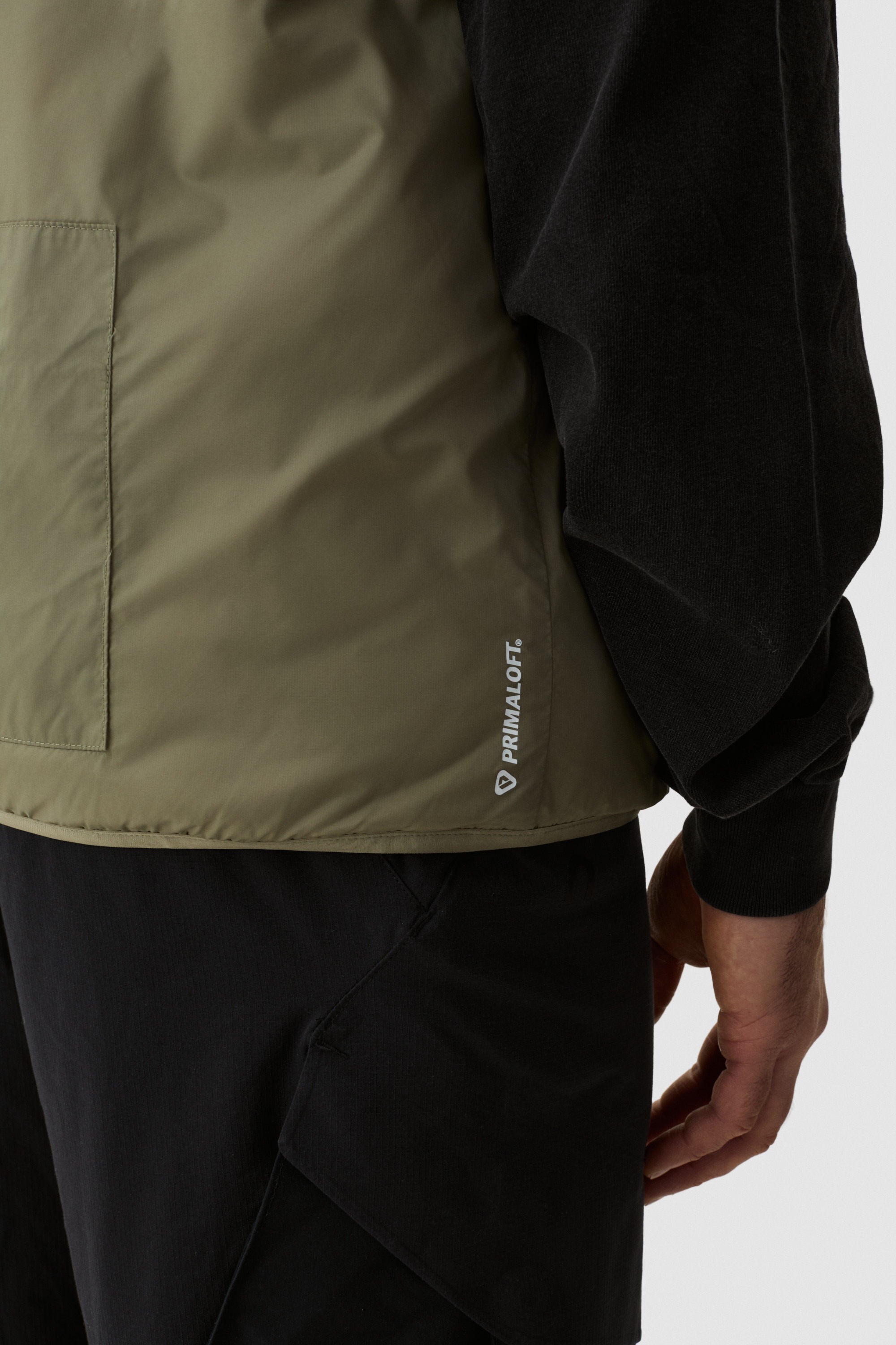 Model wearing Yama Traverse Plain Vest Moss Green