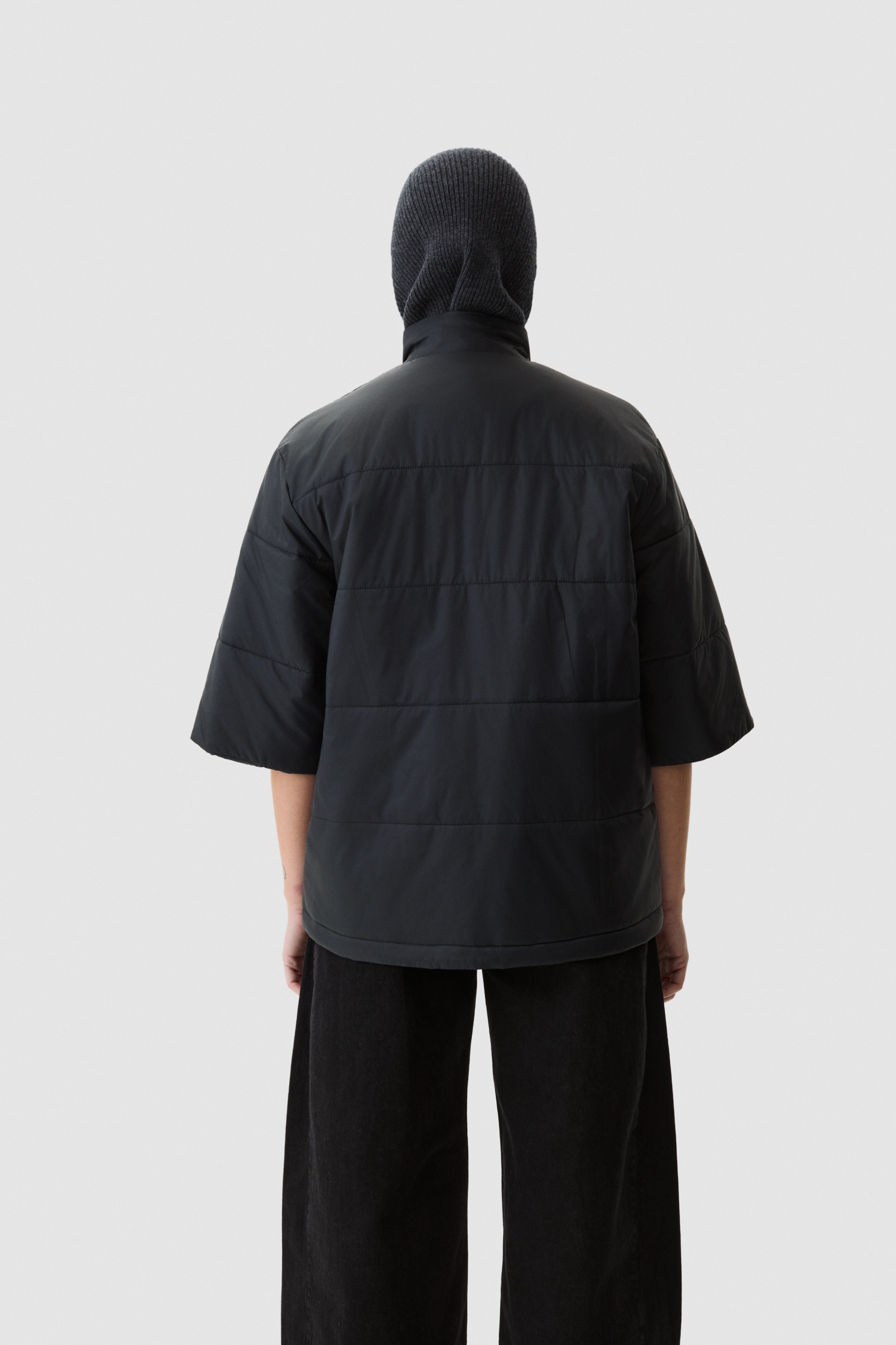 Model wearing Yama Strata Puffer Jacket Anthracite