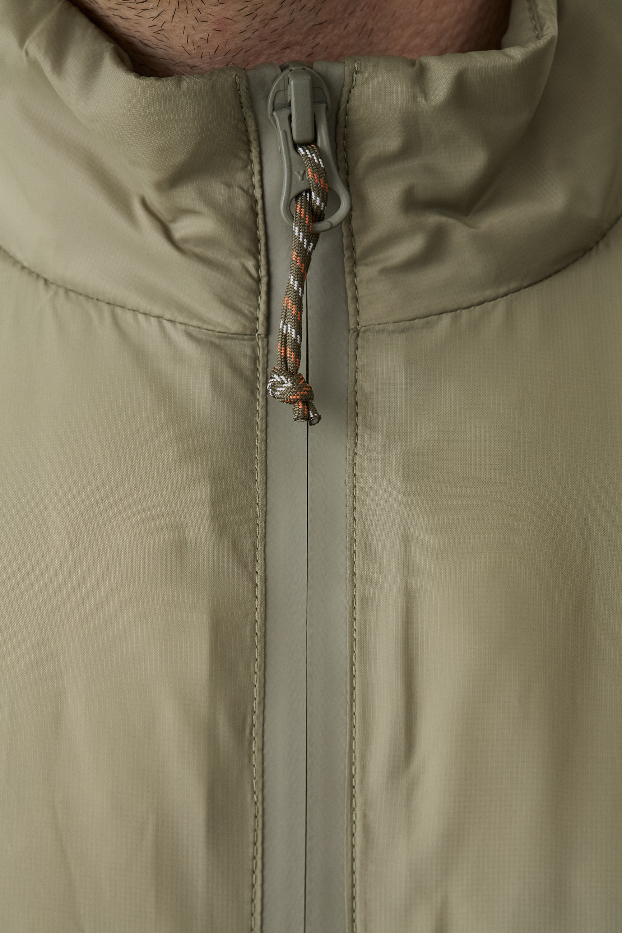 Model wearing Yama Strata Plain Jacket Moss Green