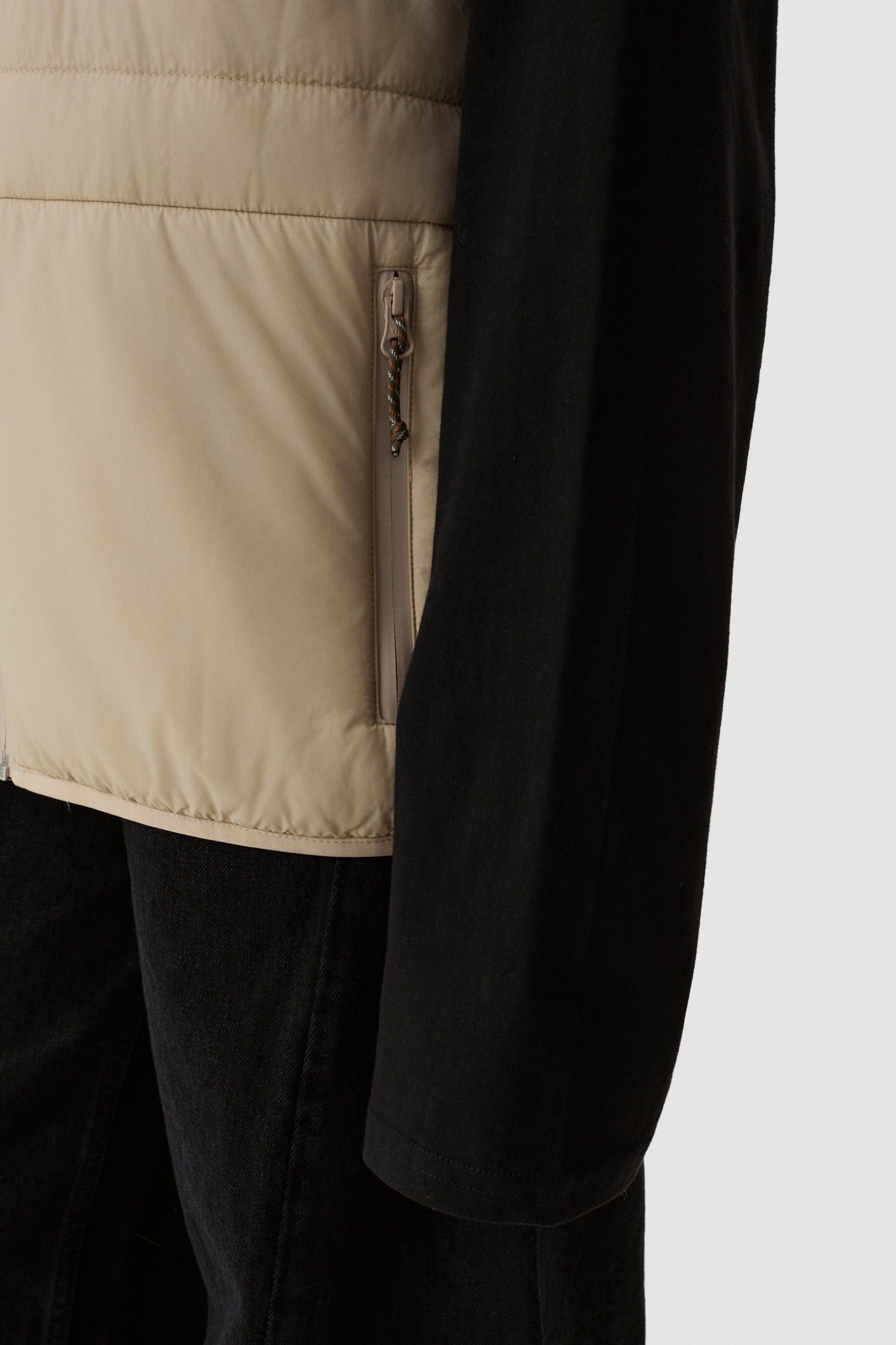 Model wearing Yama Traverse Puffer Vest Sand Dune