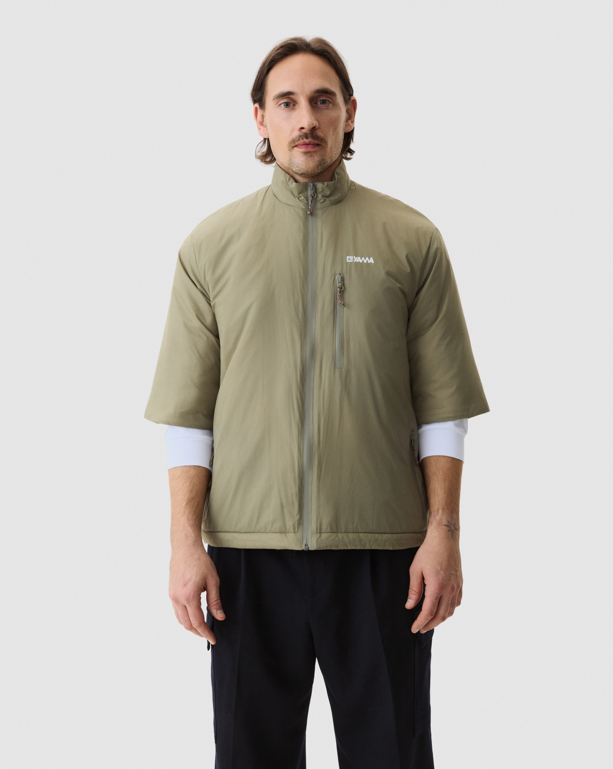 Model wearing Yama Strata Plain Jacket Moss Green