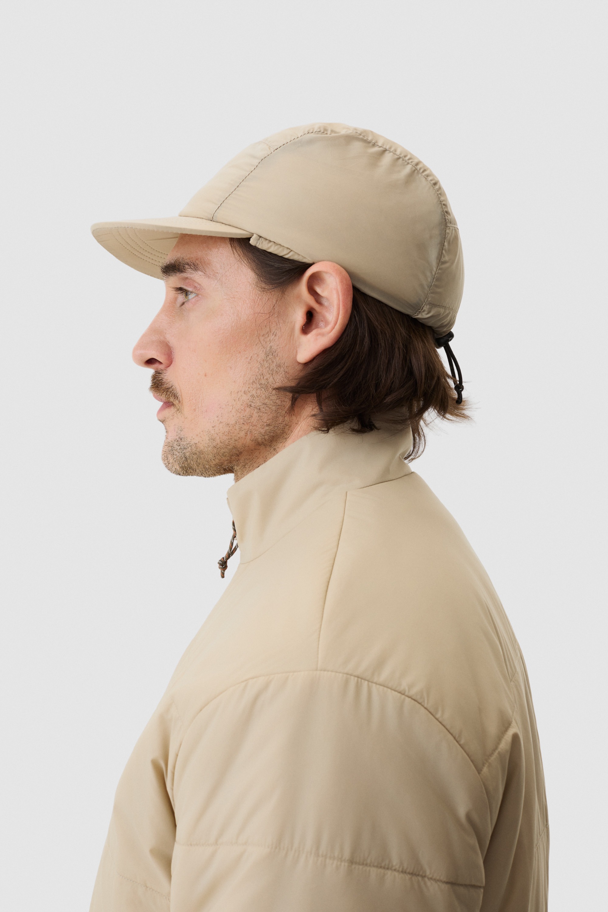 Model wearing Yama Vertex Cap Sand Dune