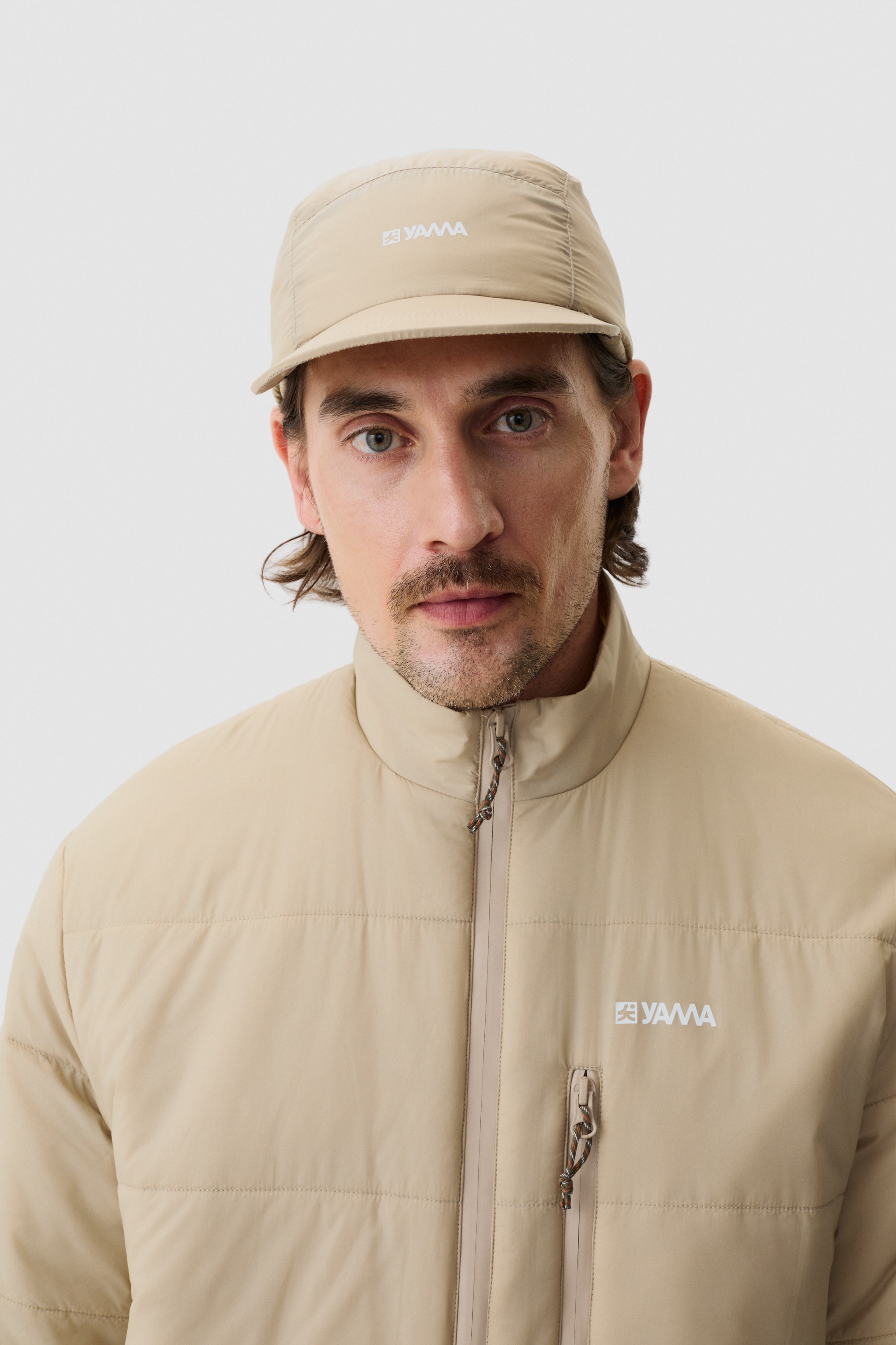 Model wearing Yama Vertex Cap Sand Dune