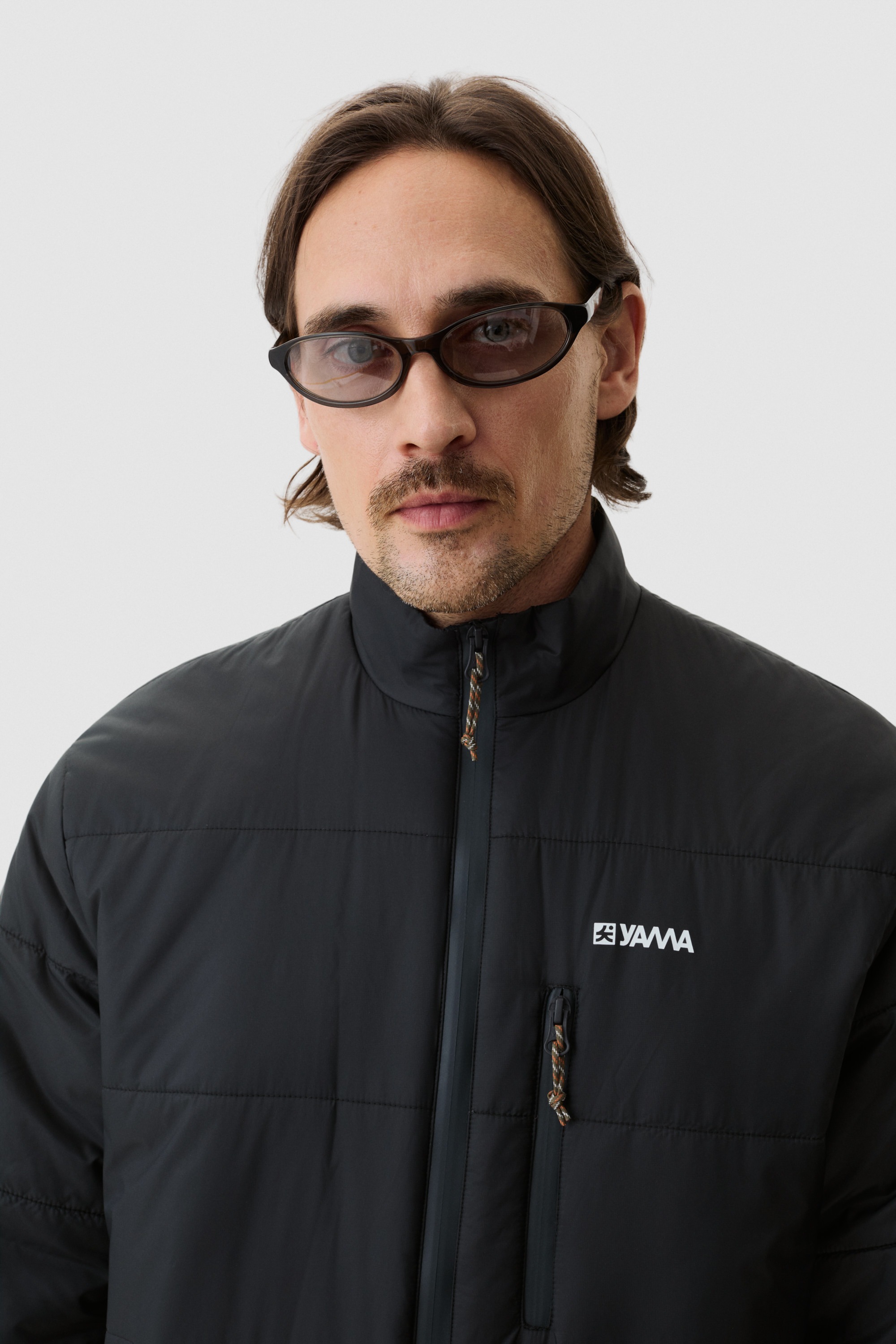 Model wearing Yama Strata Puffer Jacket Anthracite