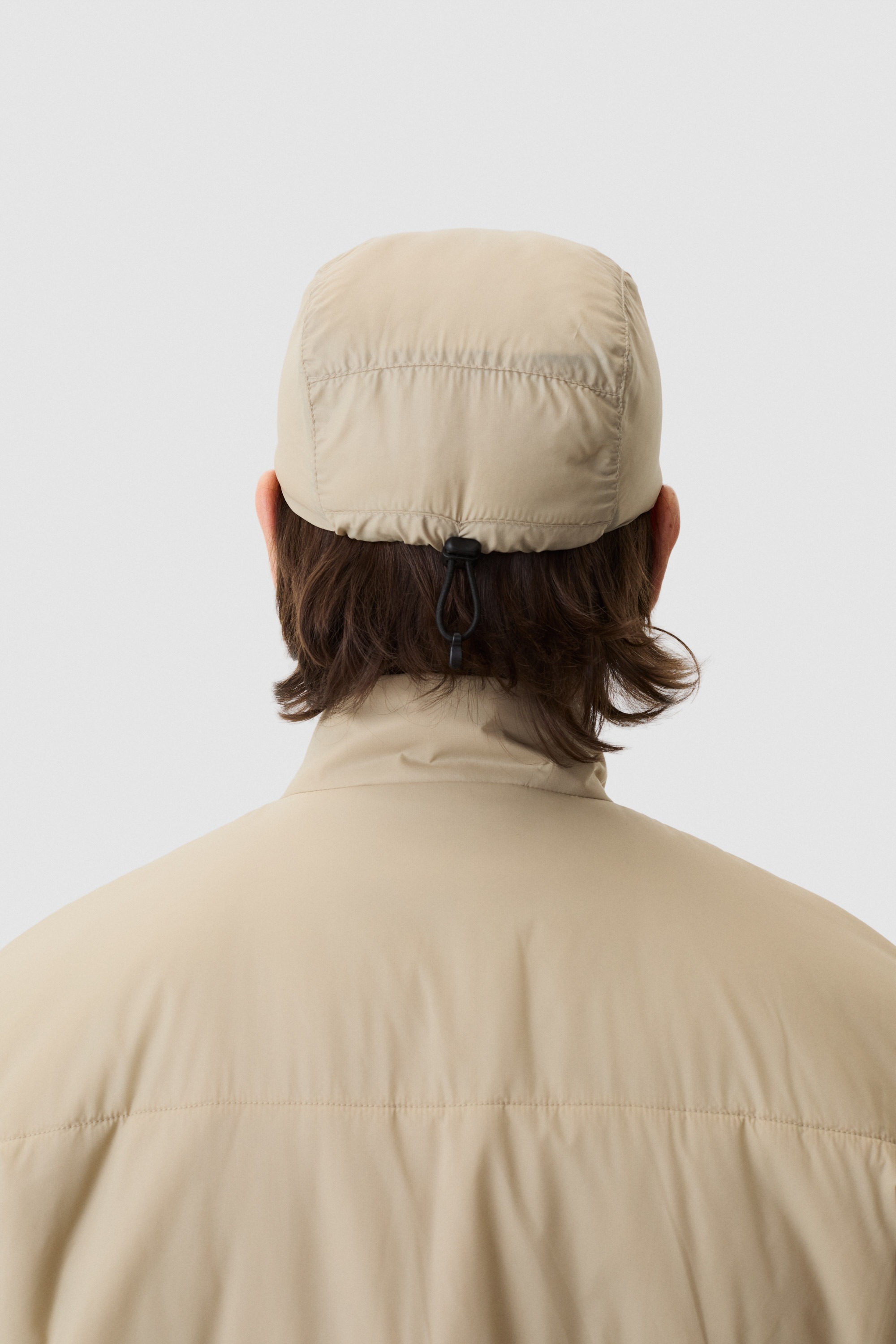 Model wearing Yama Vertex Cap Sand Dune