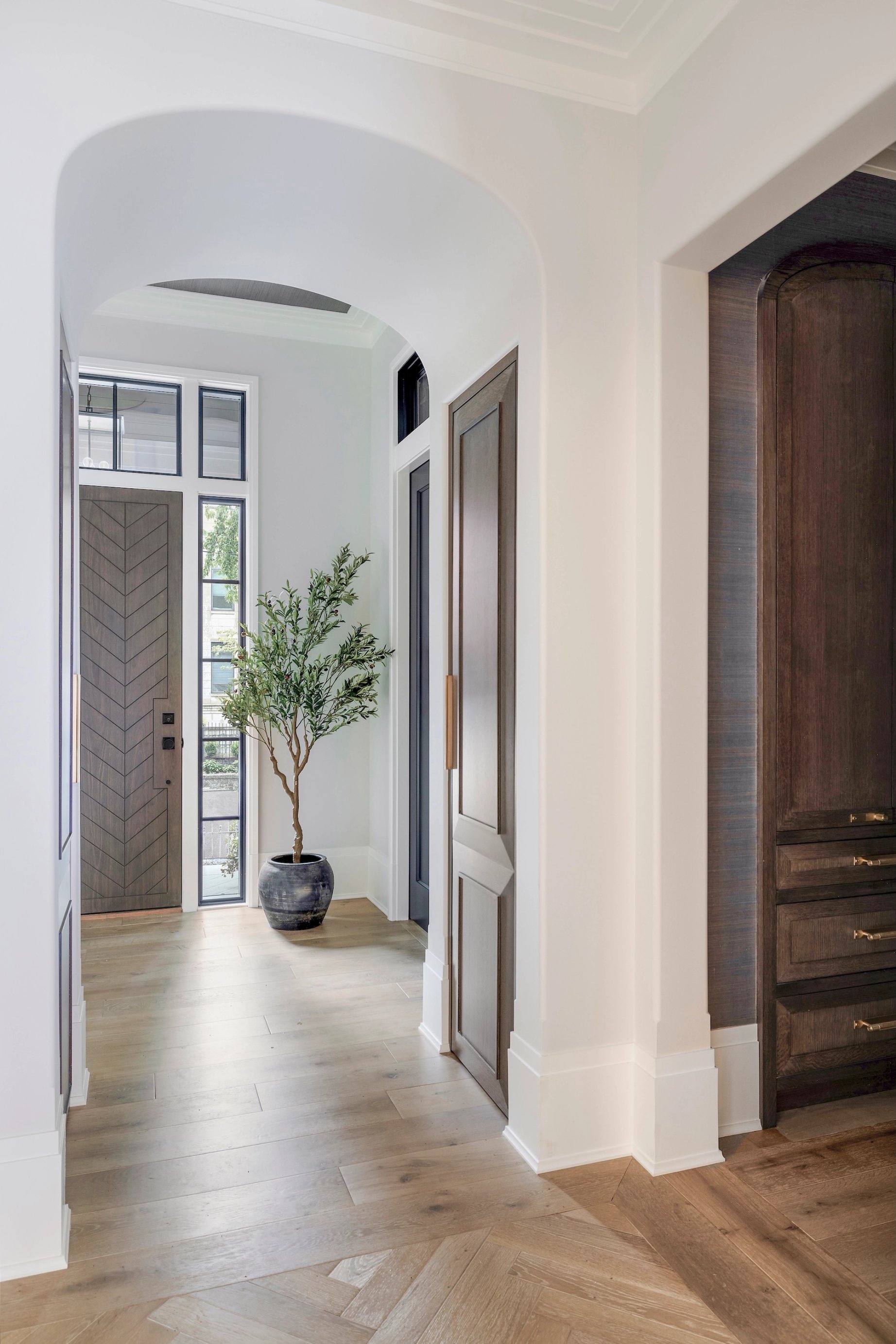 Dawn Reeves Design Luxury Interior Design Chicago Illinois Erie Foyer Arched Hallway Olive Tree