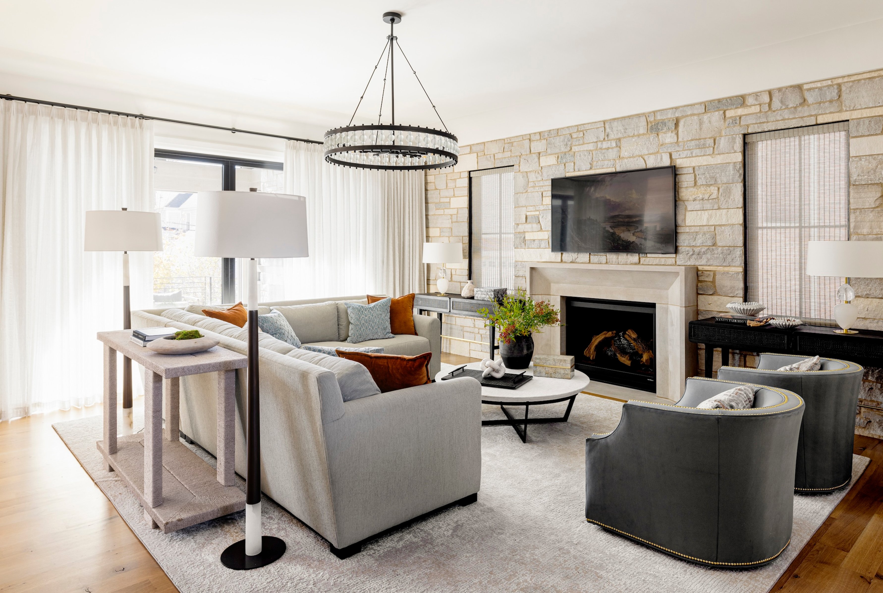 Dawn Reeves Design Luxury Interior Design Chicago Illinois Vallette Living Room Ring Chandelier Stone Fireplace