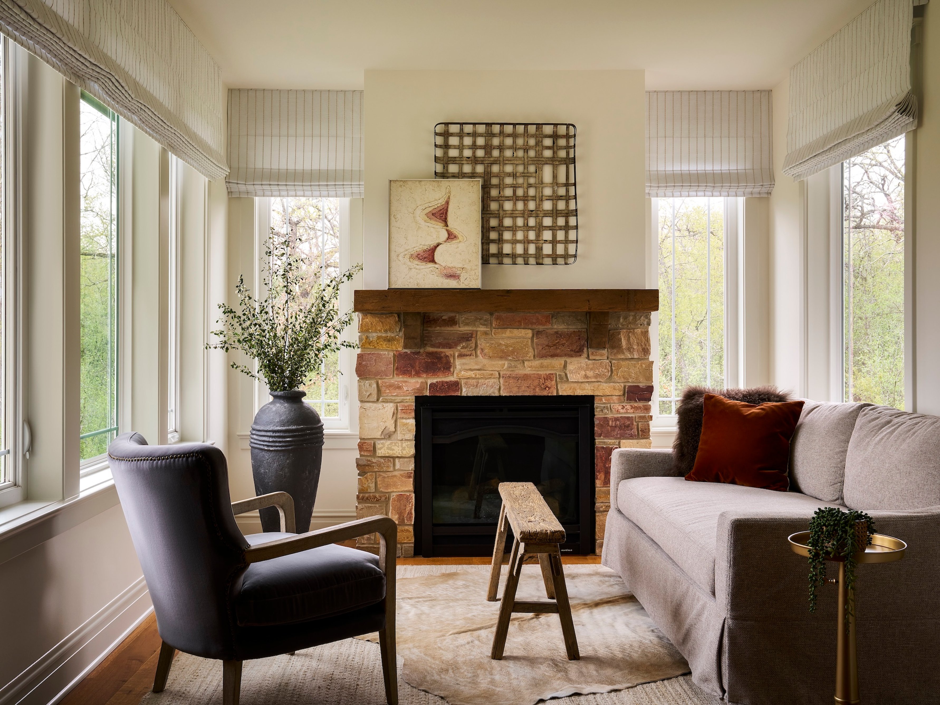 Dawn Reeves Design Luxury Interior Design Chicago Illinois Lake Geneva Sunroom Stone Fireplace Loveseat