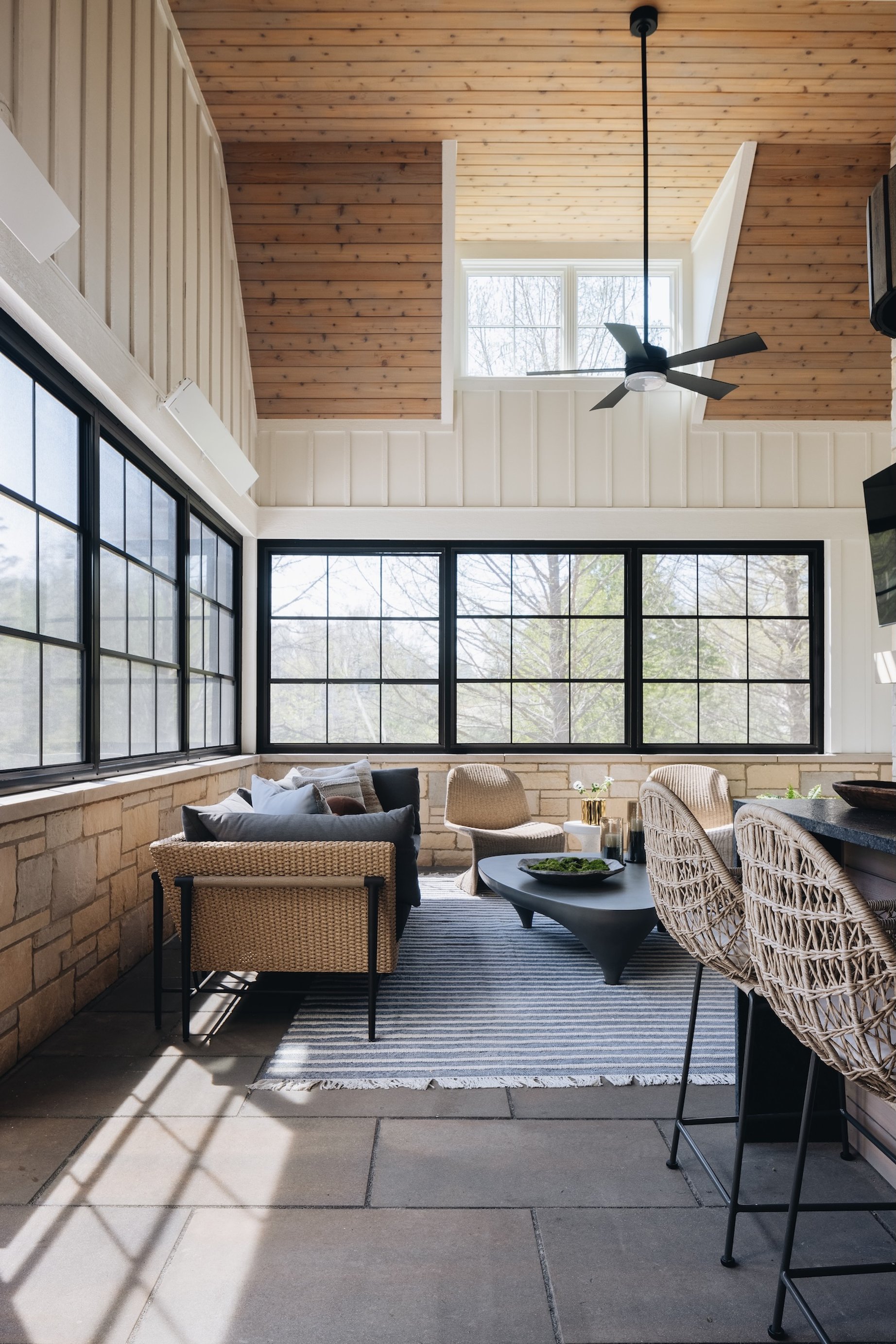 Dawn Reeves Design Luxury Interior Design Chicago Illinois Hinsdale Screened Porch Wicker Seating Stone Wall