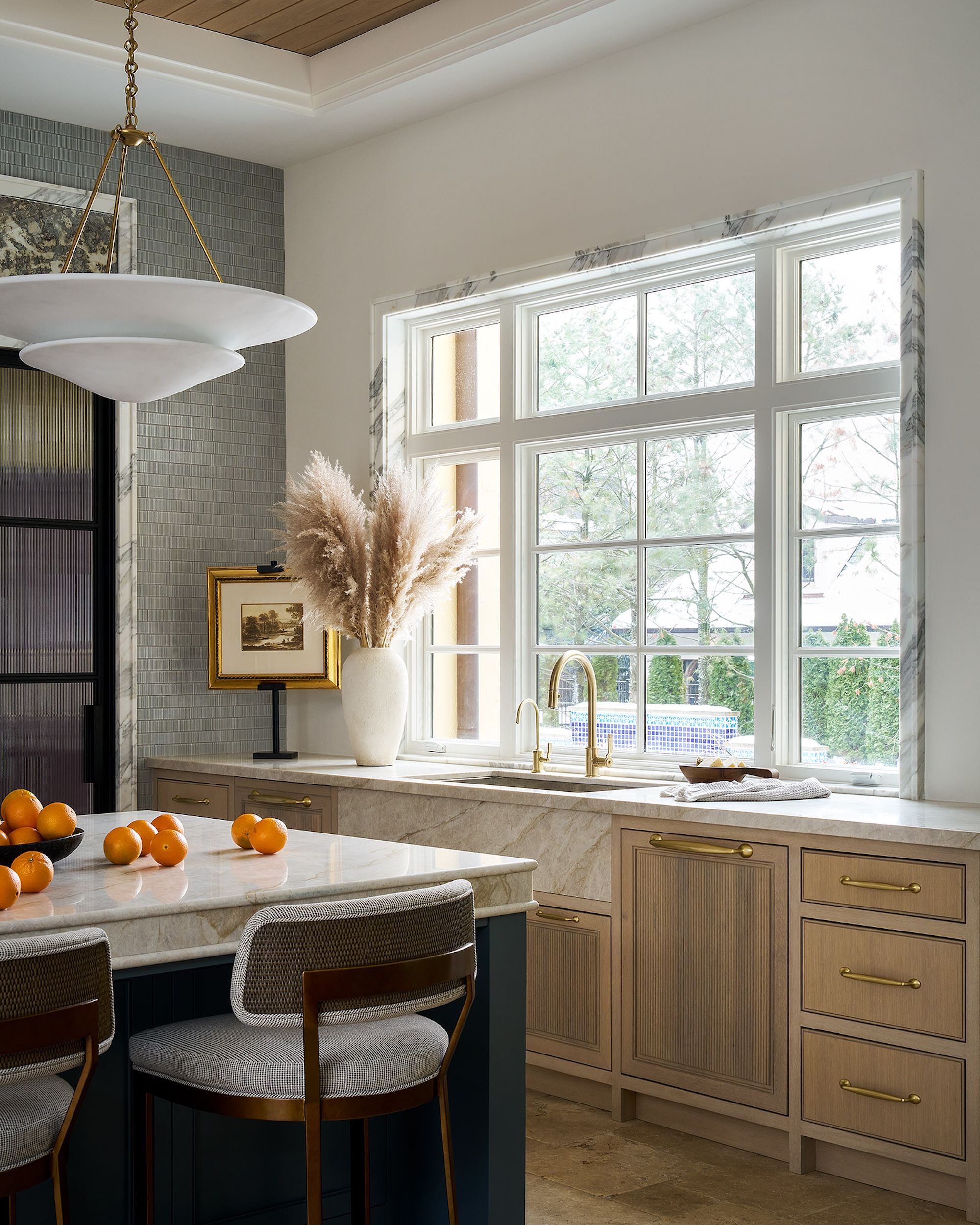 Dawn Reeves Design Luxury Interior Design Chicago Illinois Kitchen Marble Island Large Windows Pampas Grass