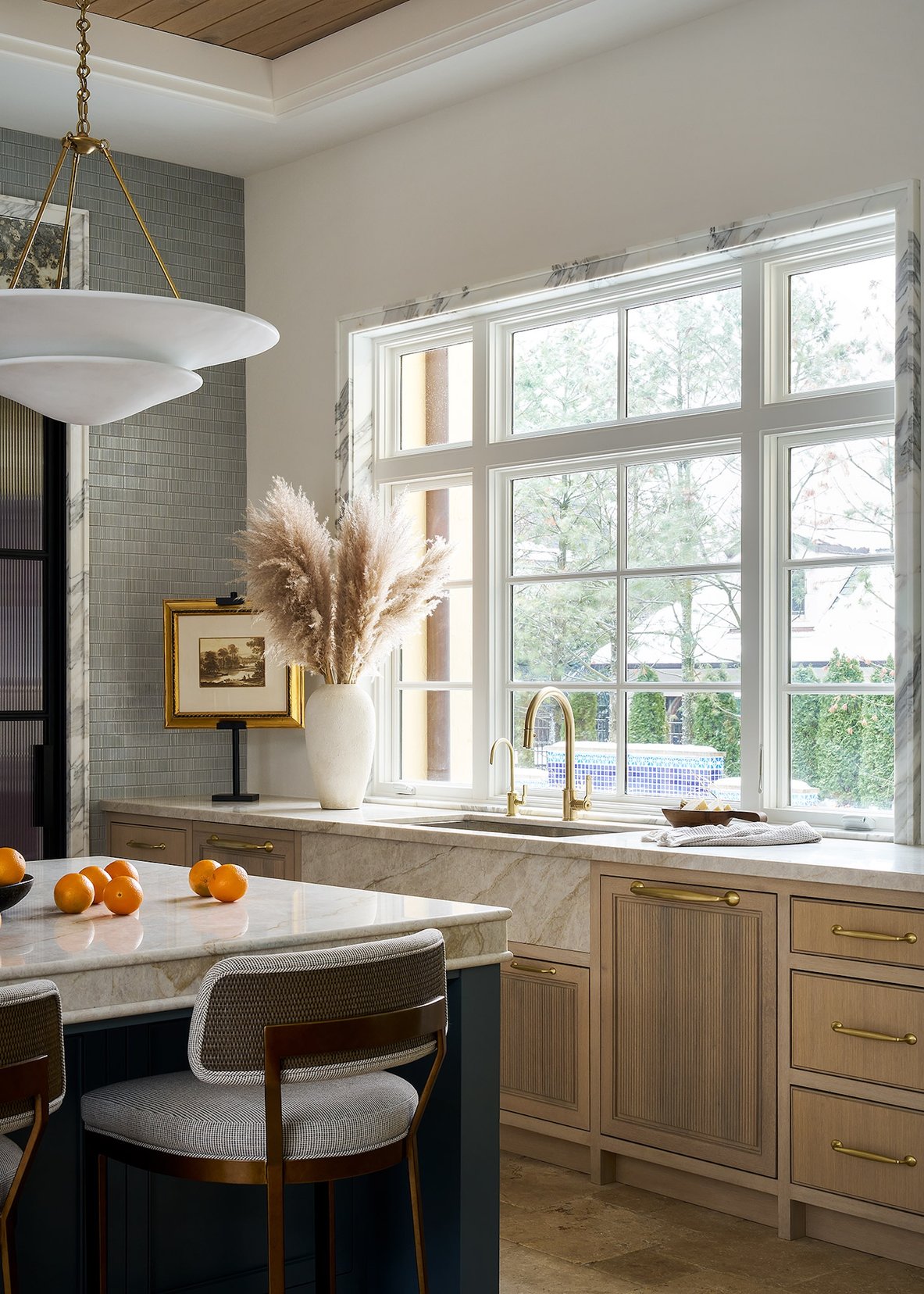 Dawn Reeves Design Luxury Interior Design Chicago Illinois Kitchen Marble Island Large Windows Pampas Grass