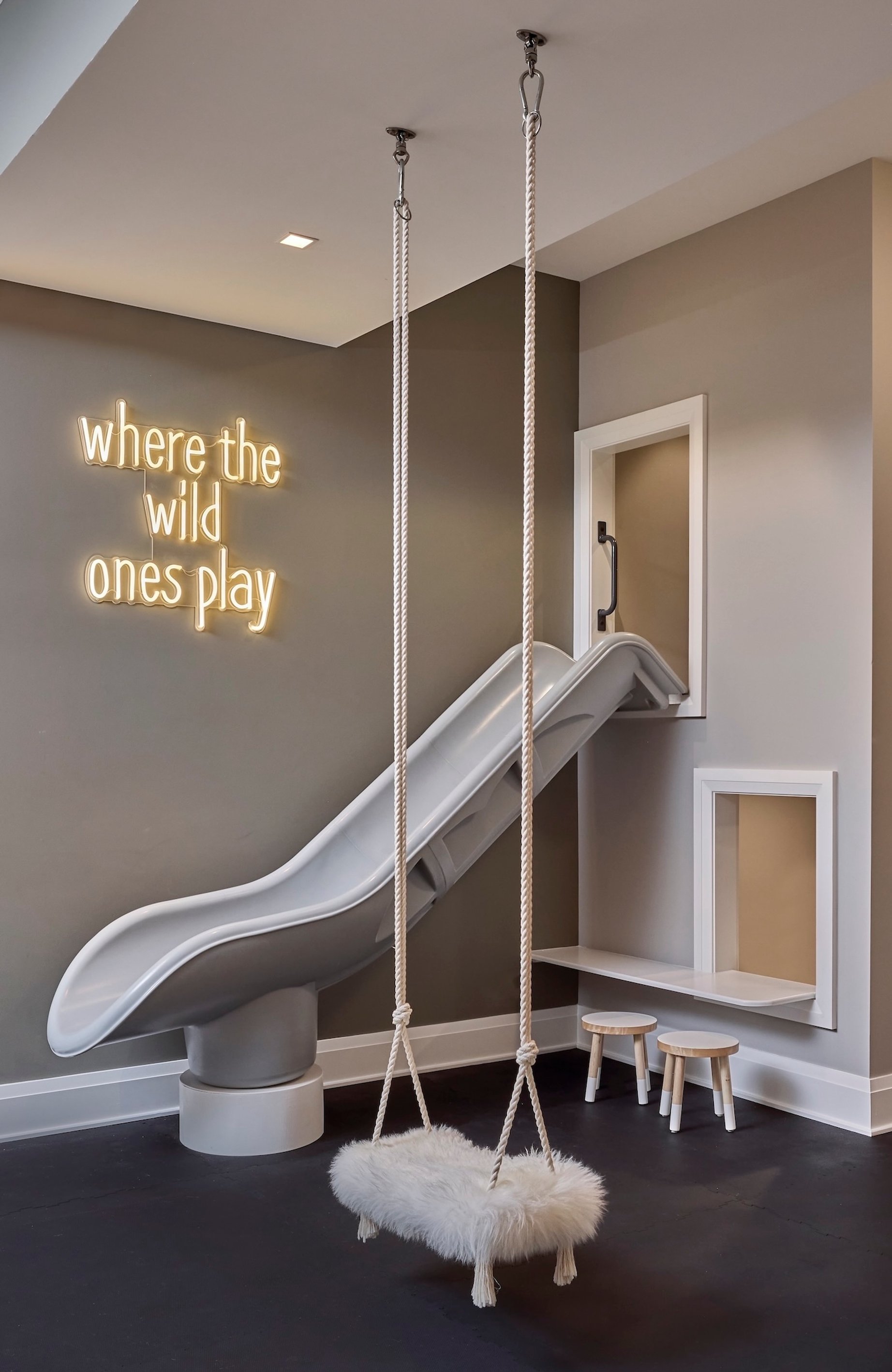 Dawn Reeves Design Luxury Interior Design Chicago Illinois Kenilworth II Playroom Slide Swing Neon Sign