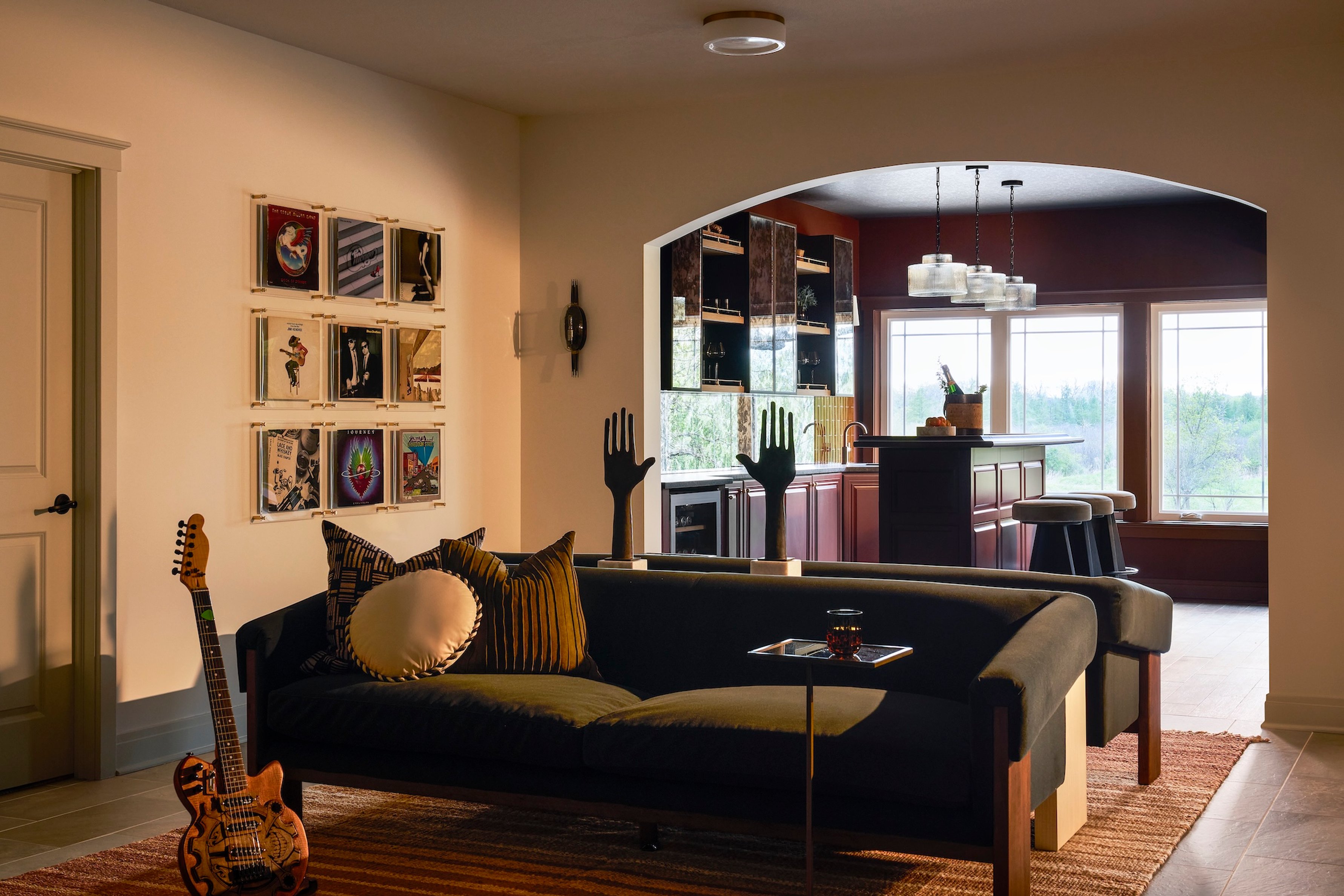 Dawn Reeves Design Luxury Interior Design Chicago Illinois Lake Geneva Family Room Green Sofa Guitar Bar View