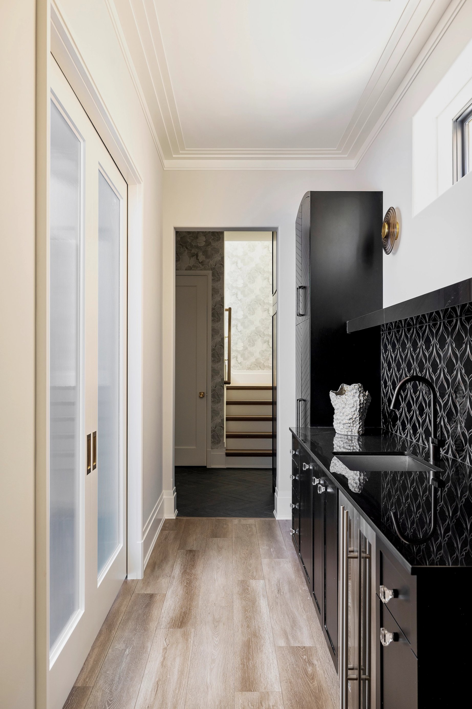 Dawn Reeves Design Luxury Interior Design Chicago Illinois Erie Hallway Black Bar Pocket Door