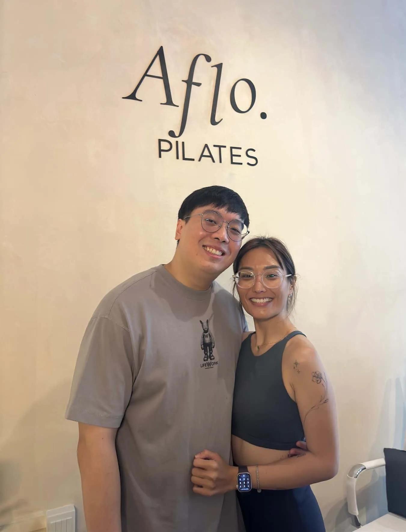 Reuben and Angie, founders of Aflo Pilates, in their reformer Pilates studio