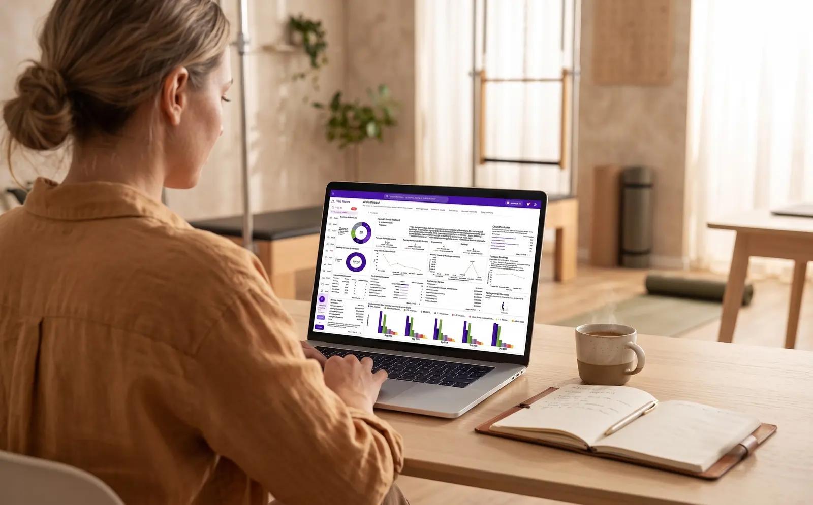 Vibefam AI Business Dashboard showing churn risk, revenue trends, and booking analytics for a boutique Pilates studio