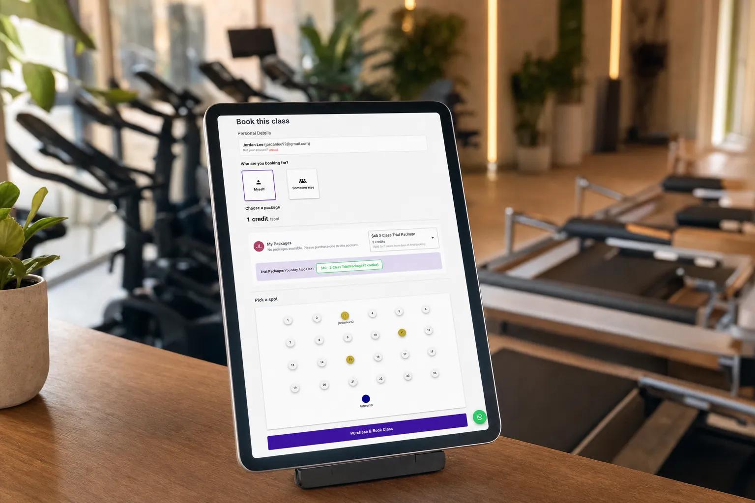 Member reserving an exact reformer spot on a Vibefam class spot map at booking