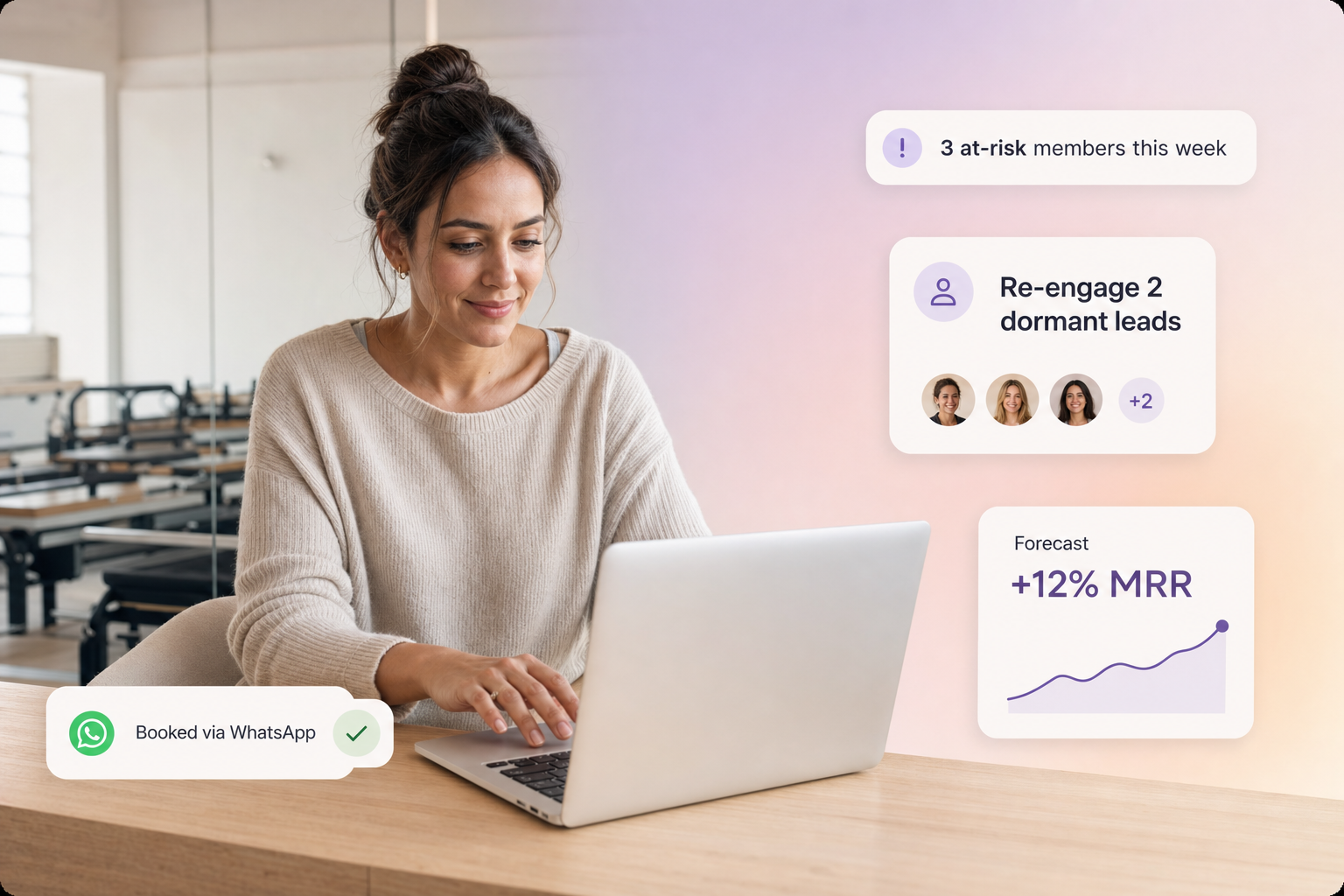 Boutique studio owner reviewing the Vibe AI Business Dashboard with floating UI cards showing at-risk members, dormant lead nurture, MRR forecast, and a WhatsApp booking confirmation