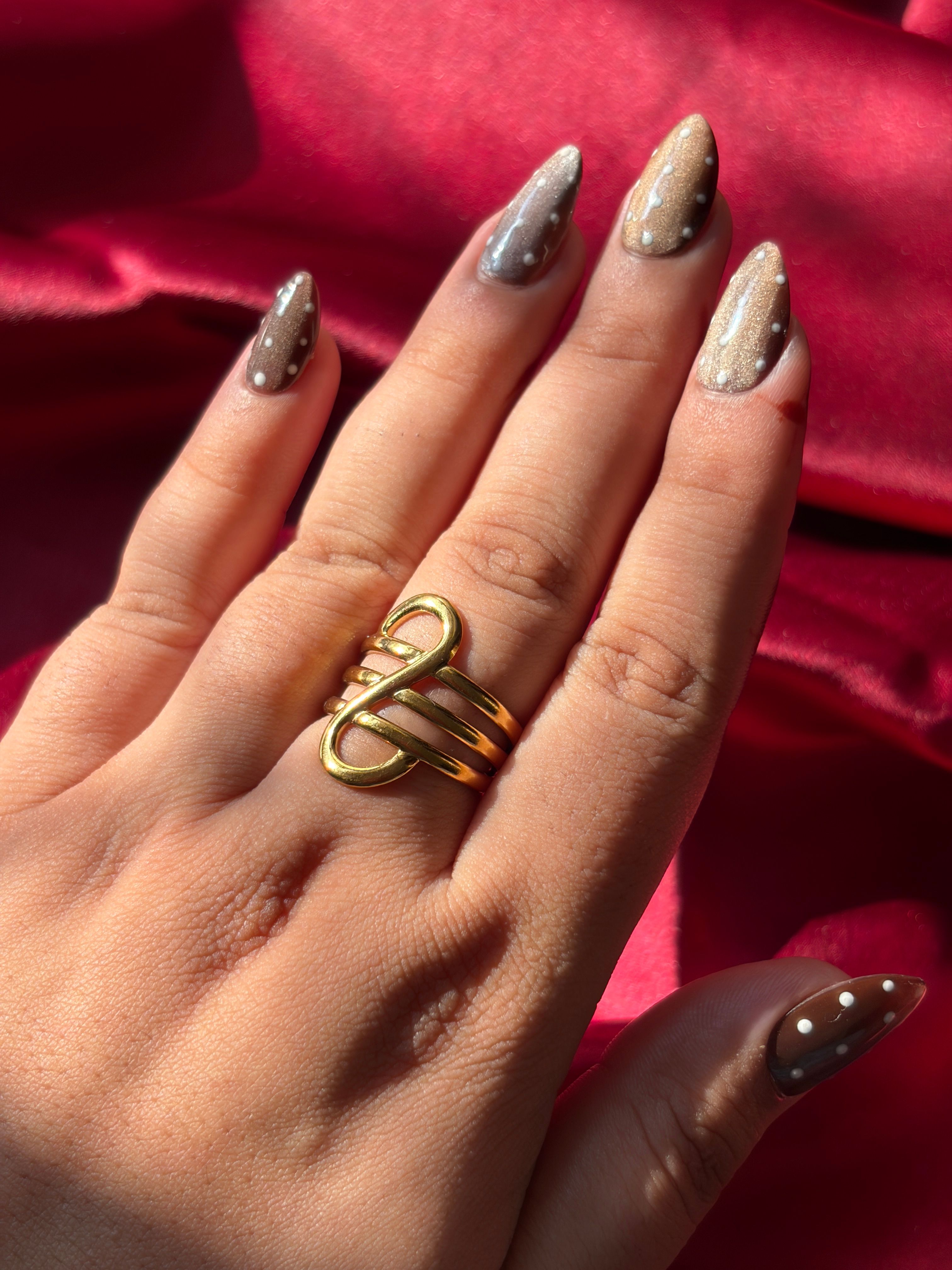 Gold Swirl Ring worn on hand — view 2