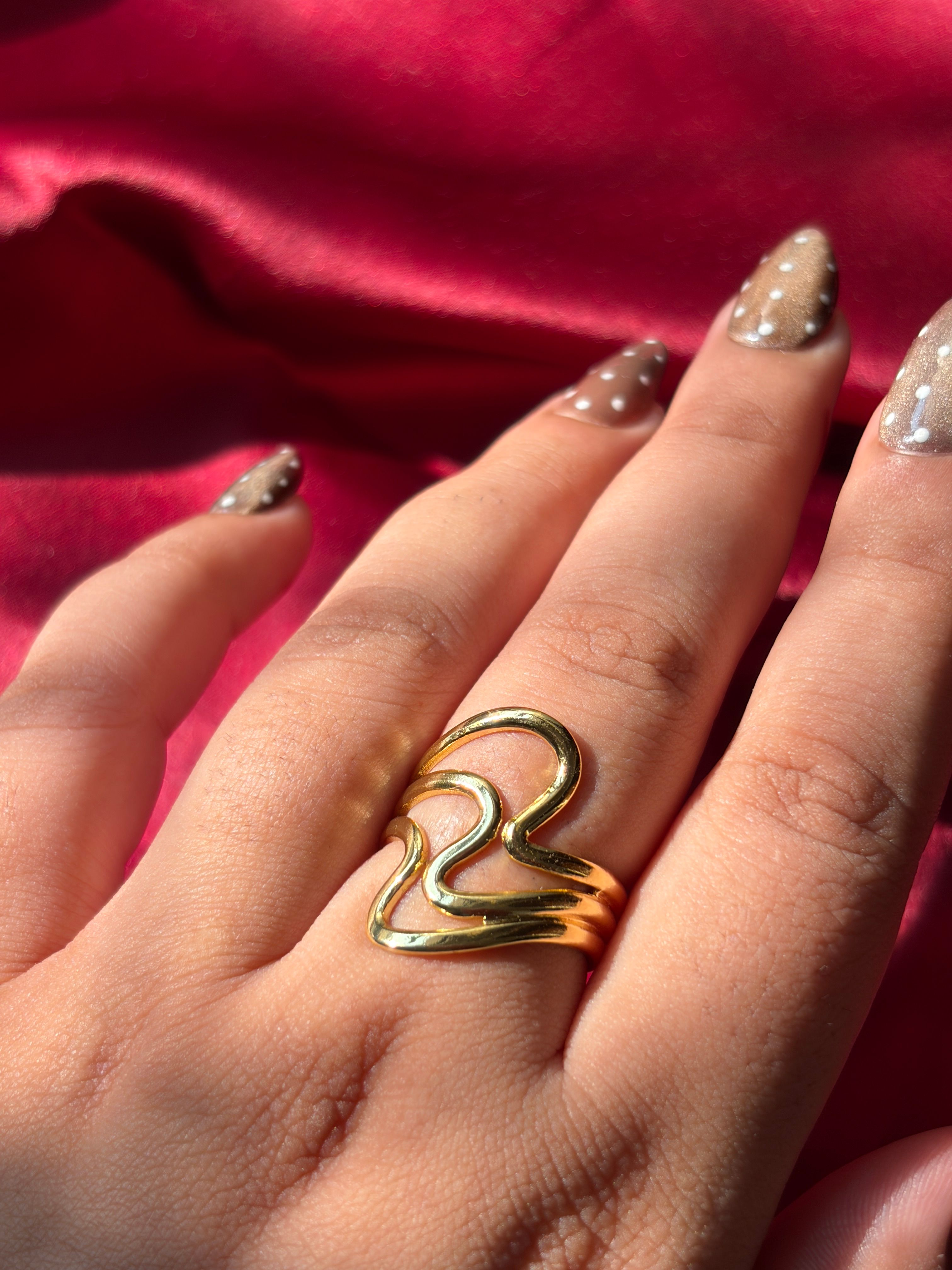 Gold Wave Ring worn on hand — view 2