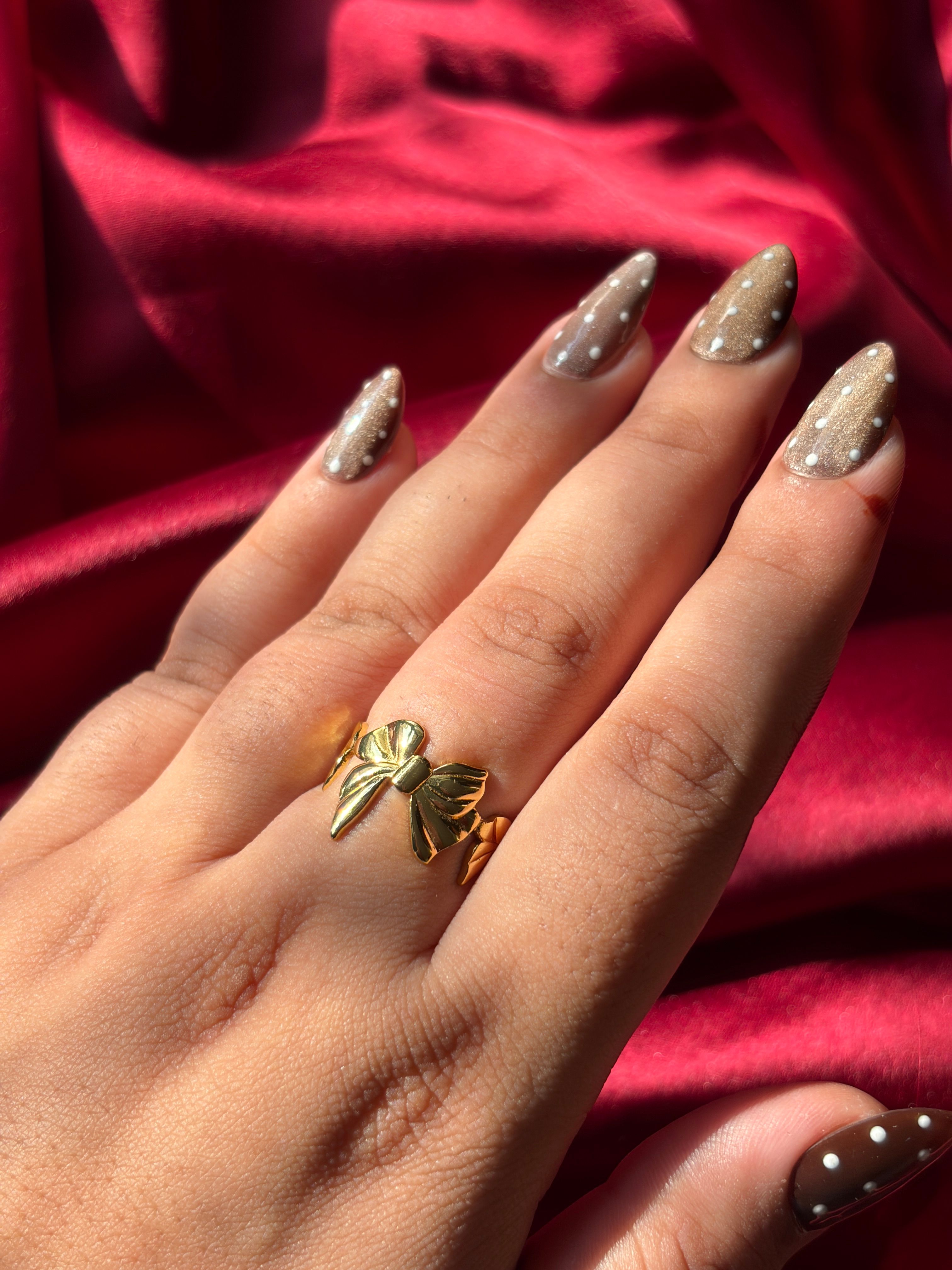 Gold Bow Ring worn on hand — view 2