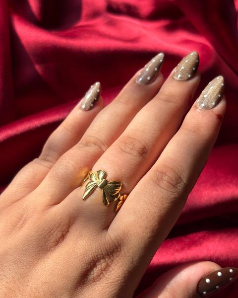 Gold Bow Ring worn on hand — view 2