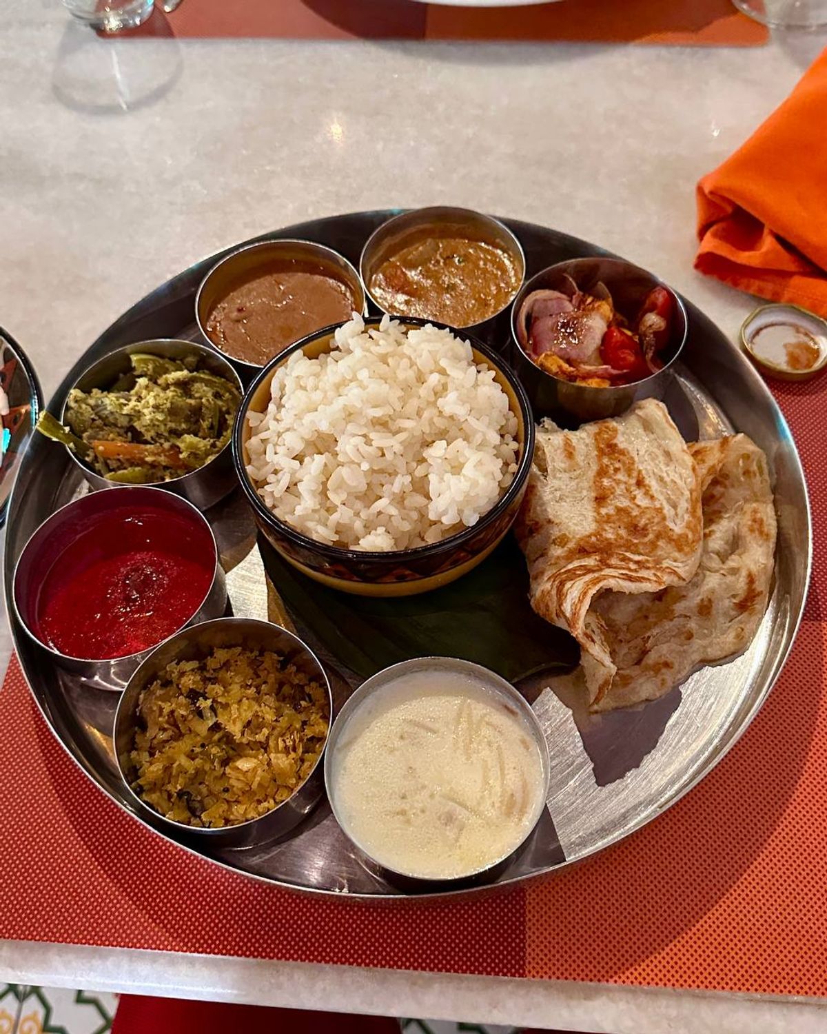 Kerala thali with parotta and variety of curries