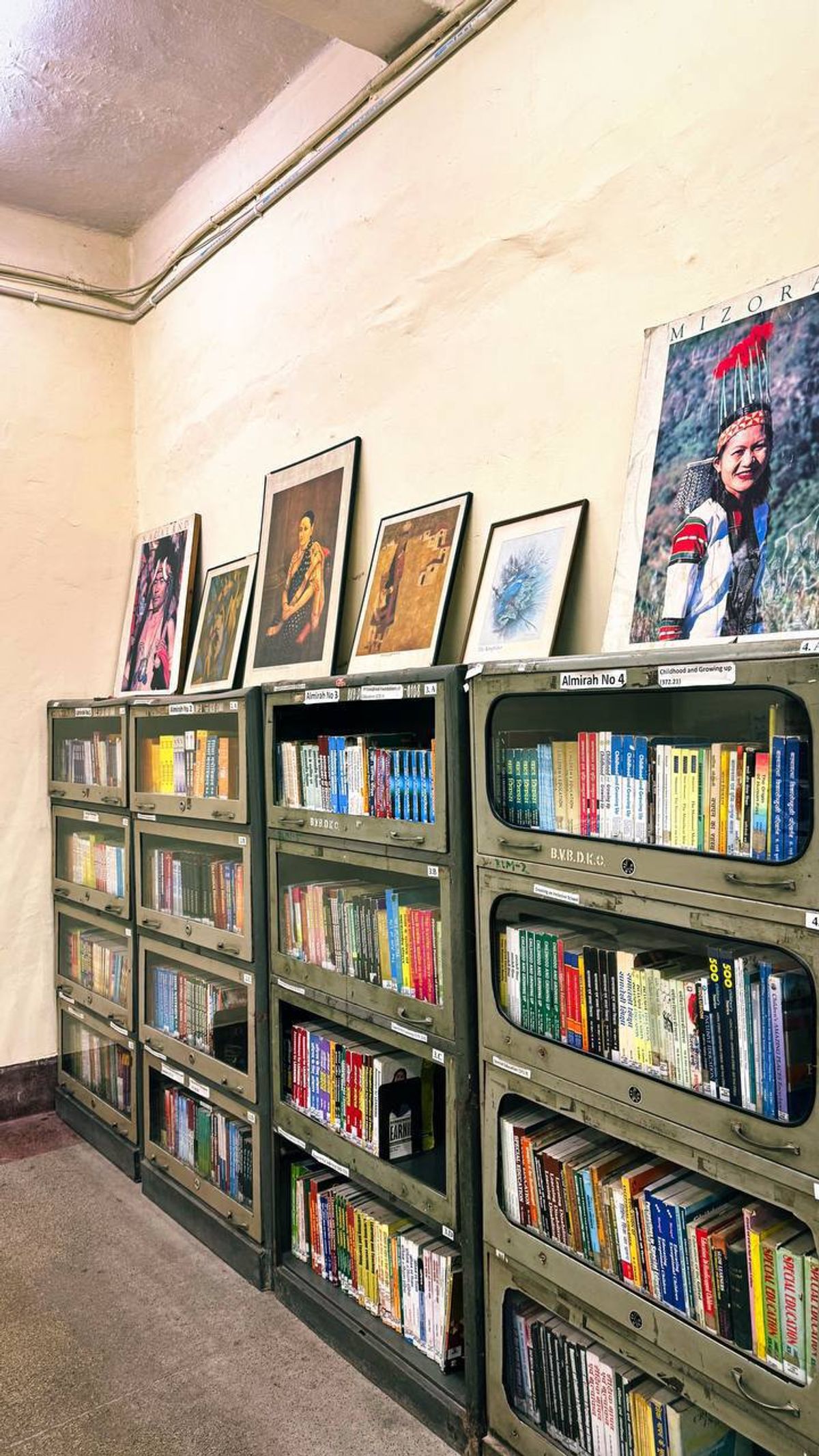 Library shelves with books and artwork