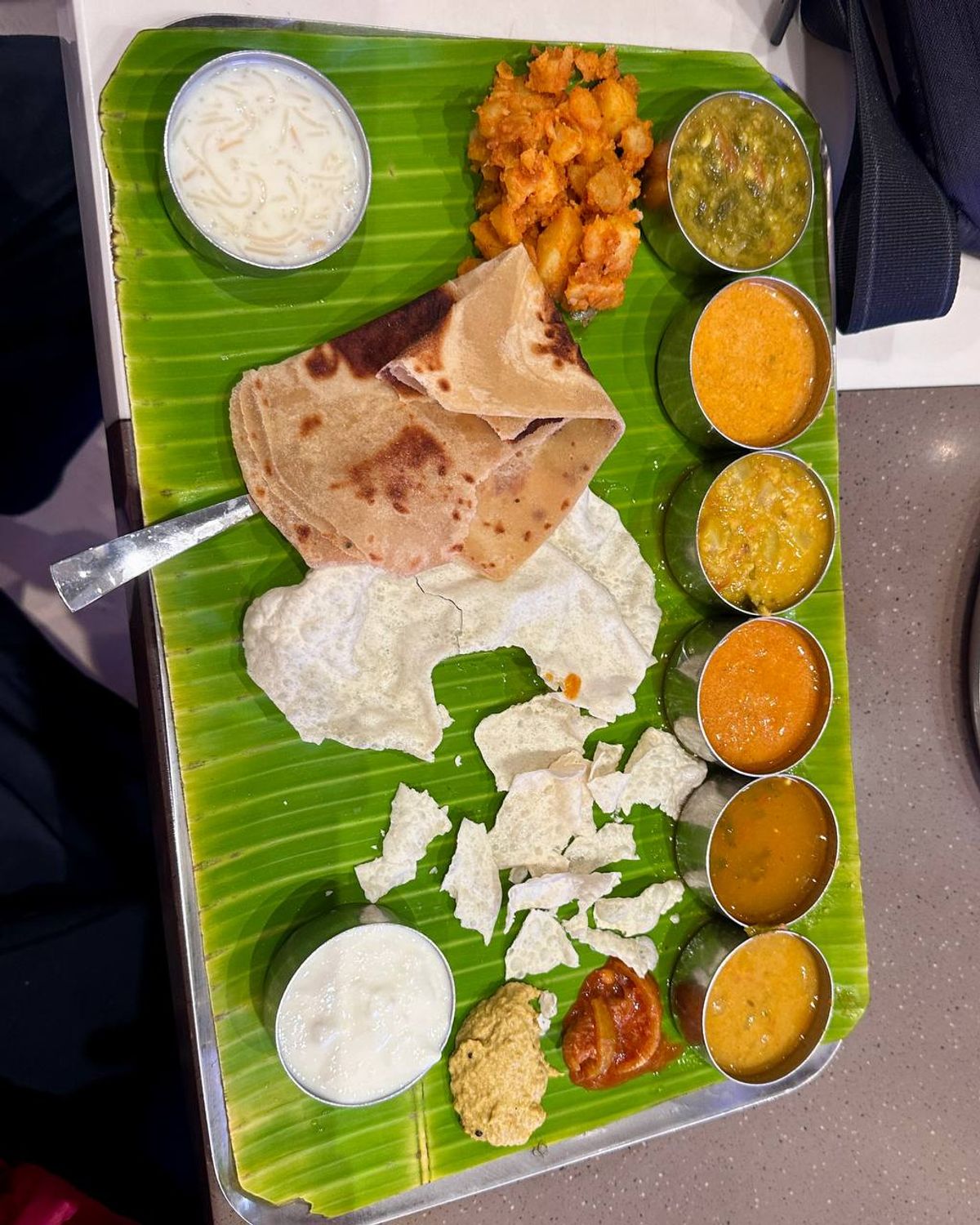 Banana leaf thali with multiple curries