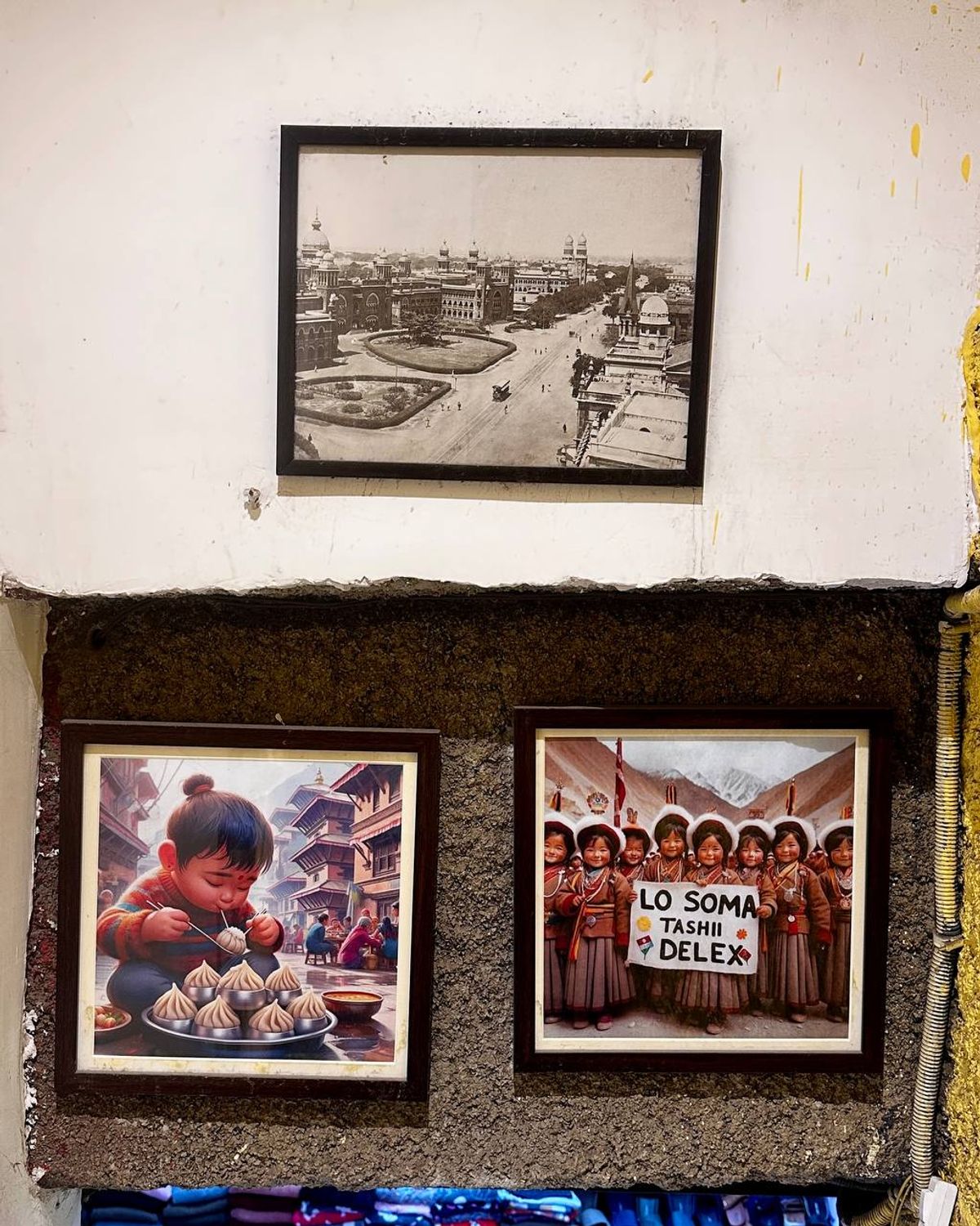 Framed photographs and art on walls of Majnu Ka Tilla