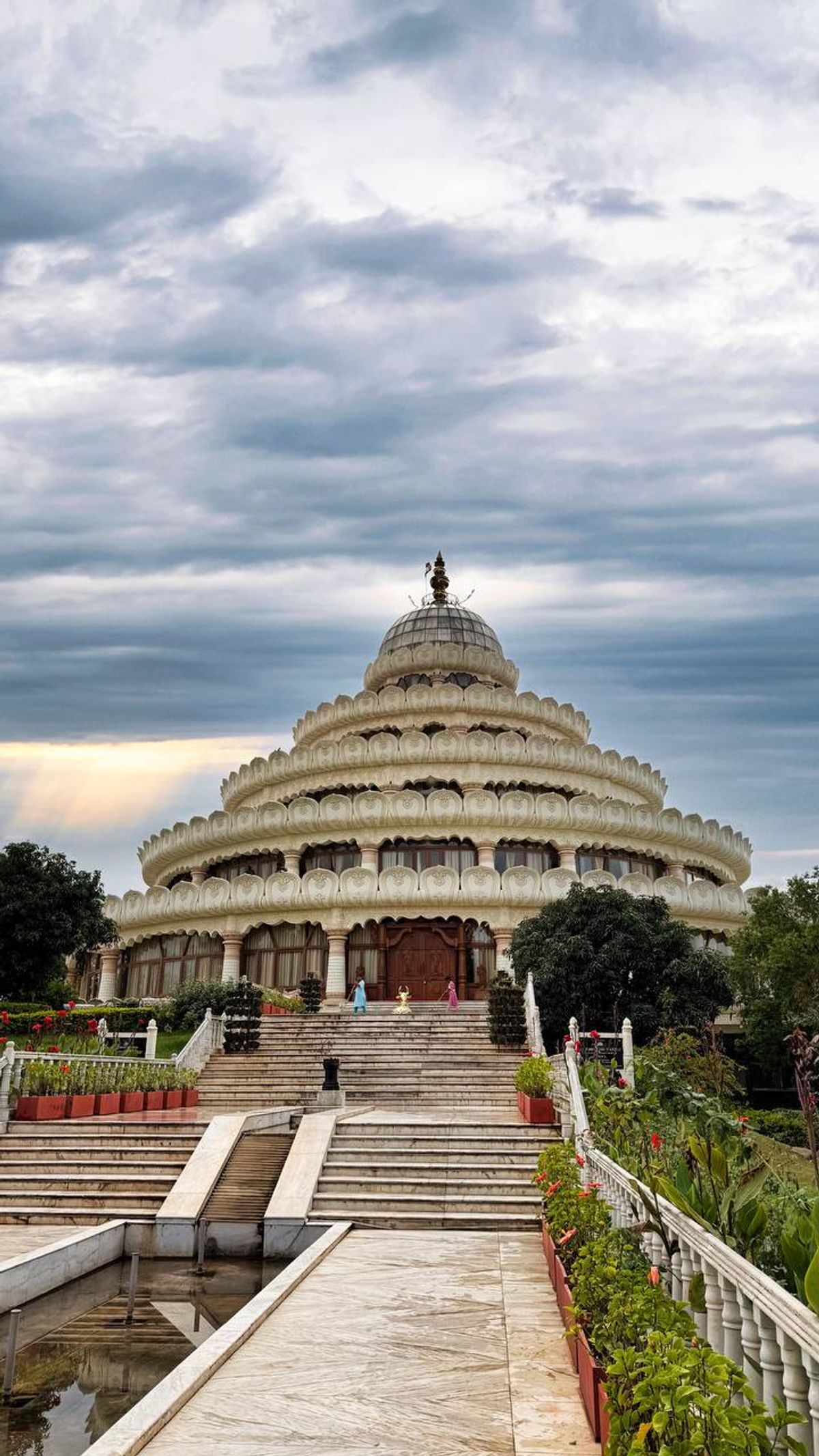 Vishalakshi Mantap meditation hall with dramatic clouds