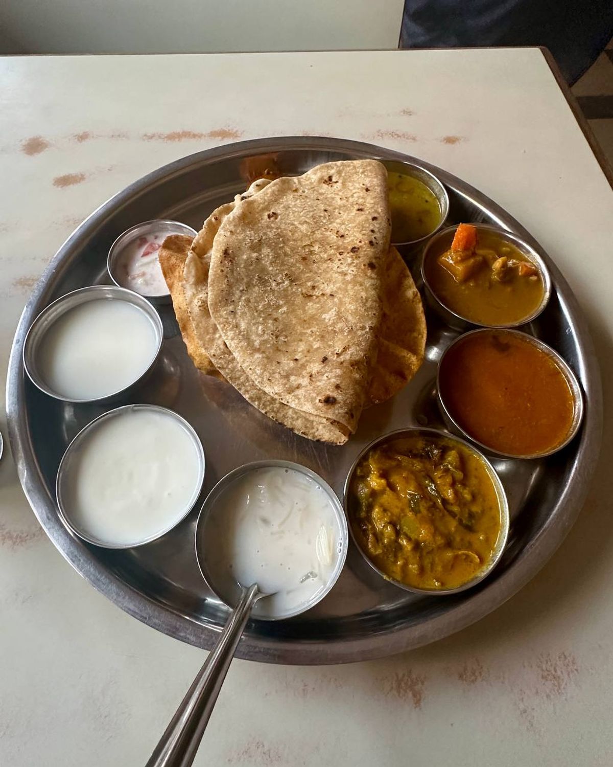 North Indian thali with roti and yogurt