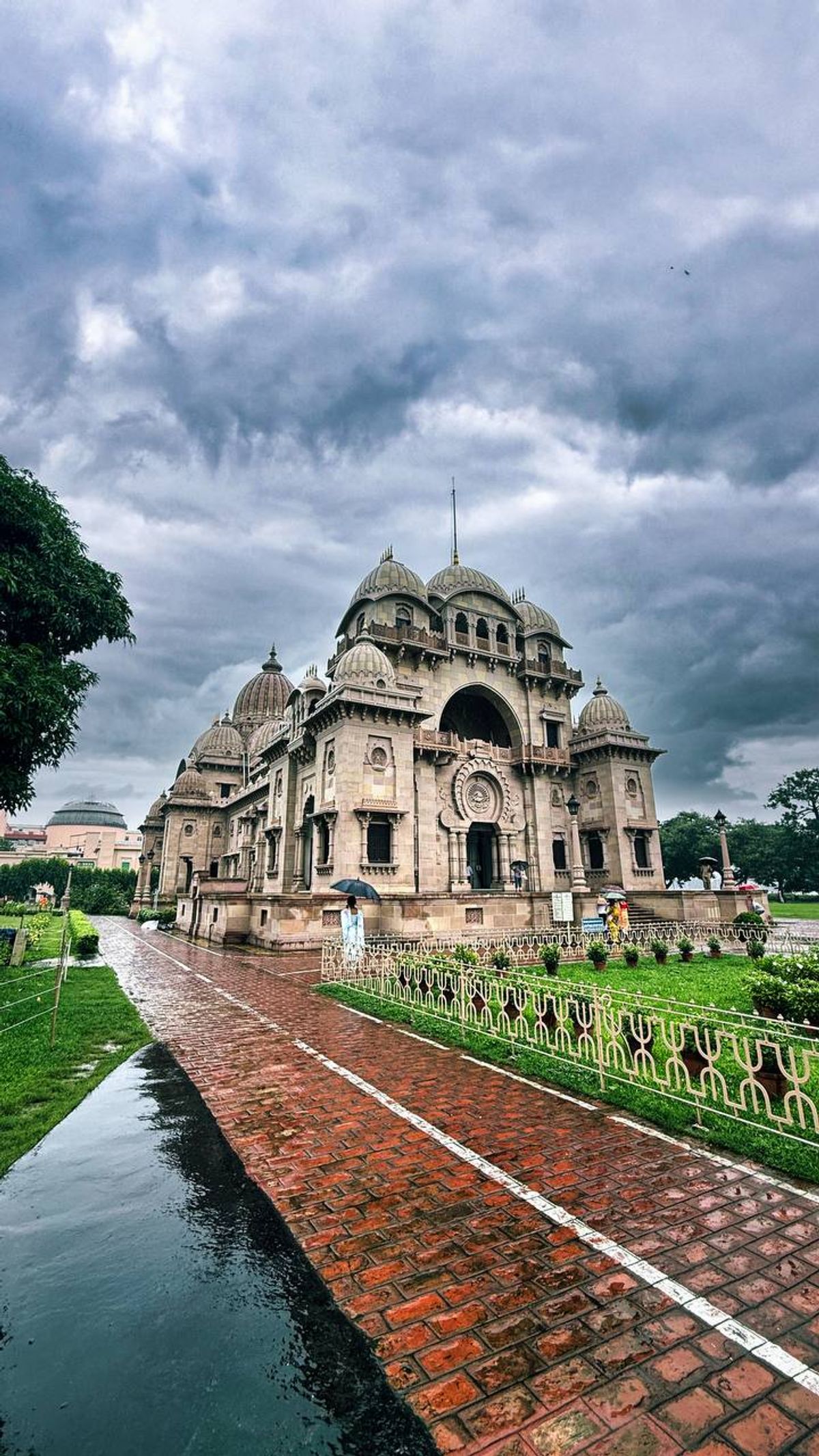 Belur Math temple with dramatic monsoon clouds