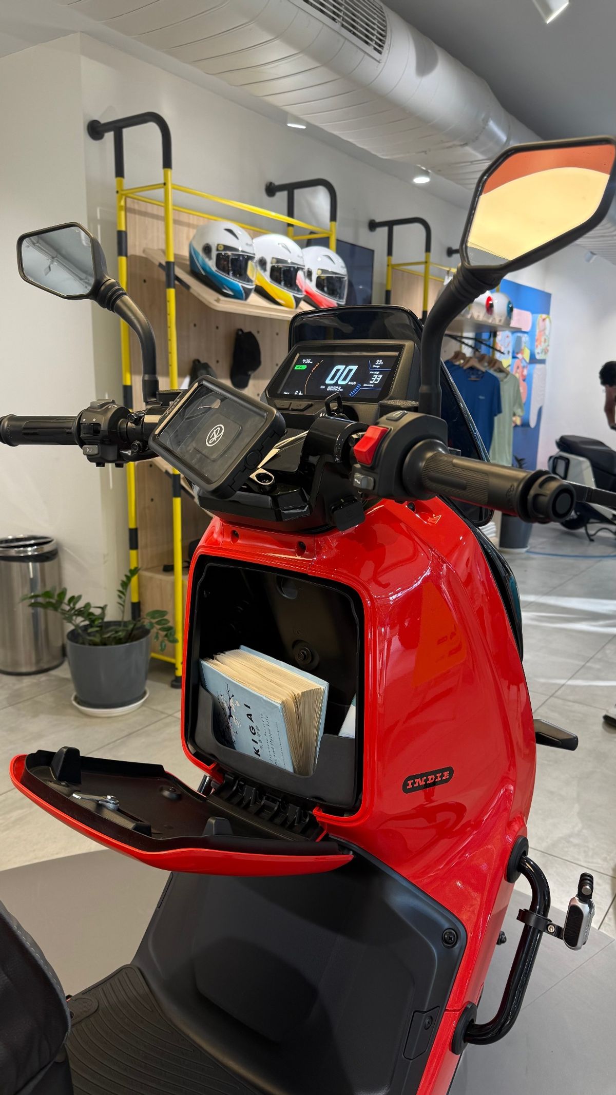 Red River Indie electric scooter with front storage compartment open