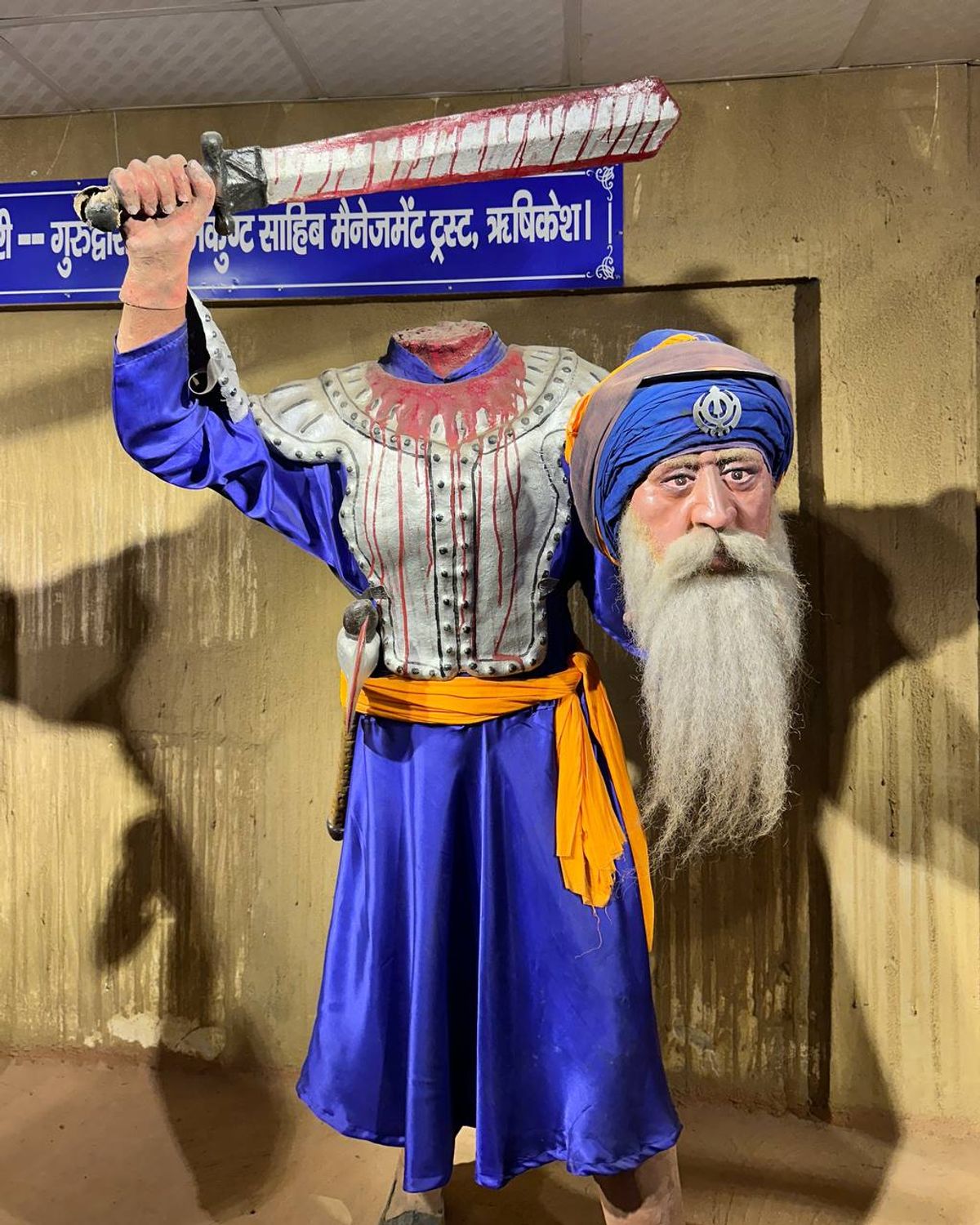 Sikh warrior statue in blue robes
