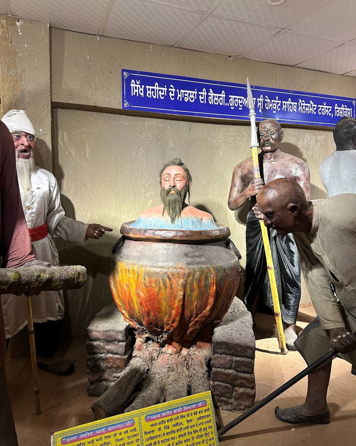 Martyrs gallery depicting Bhai Dayala boiled alive