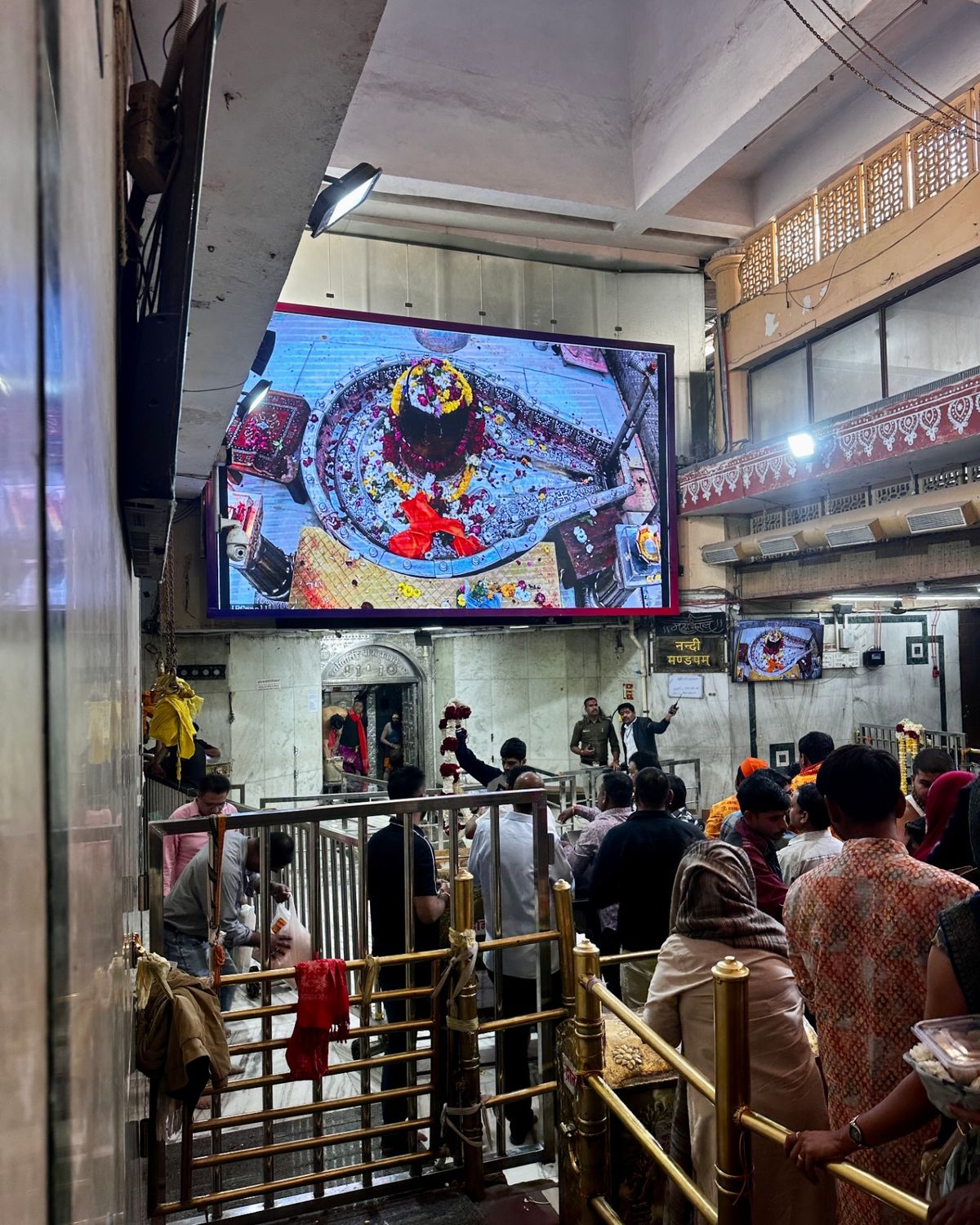Interior of Mahakaleshwar temple showing the sacred lingam on screen