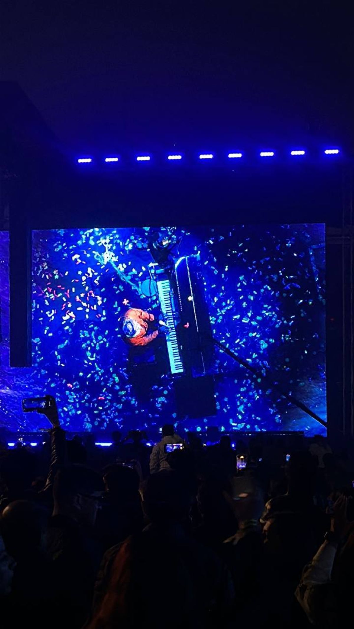 Arijit Singh performing at piano during Delhi concert