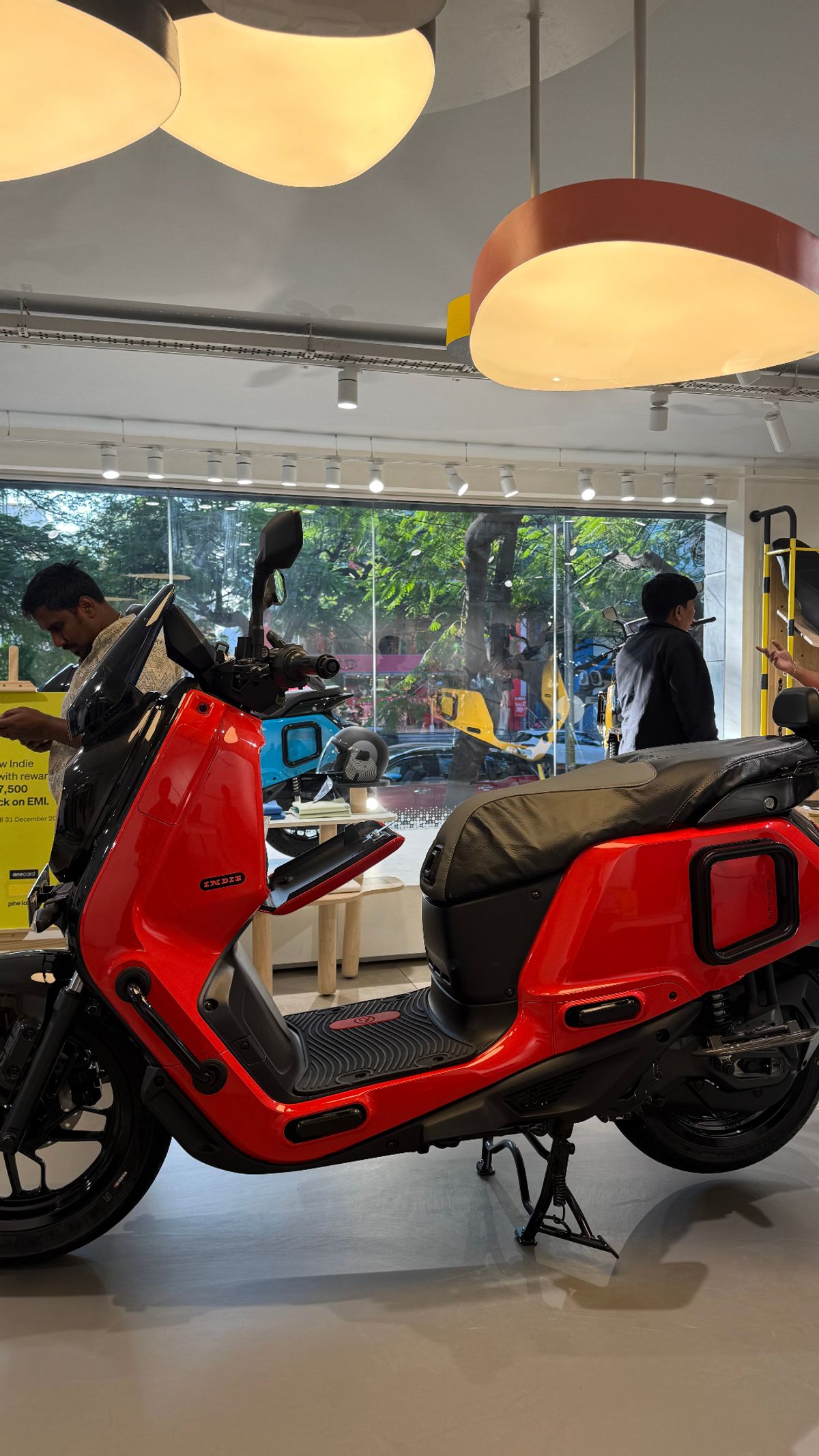 Red River Indie electric scooter full side view in showroom
