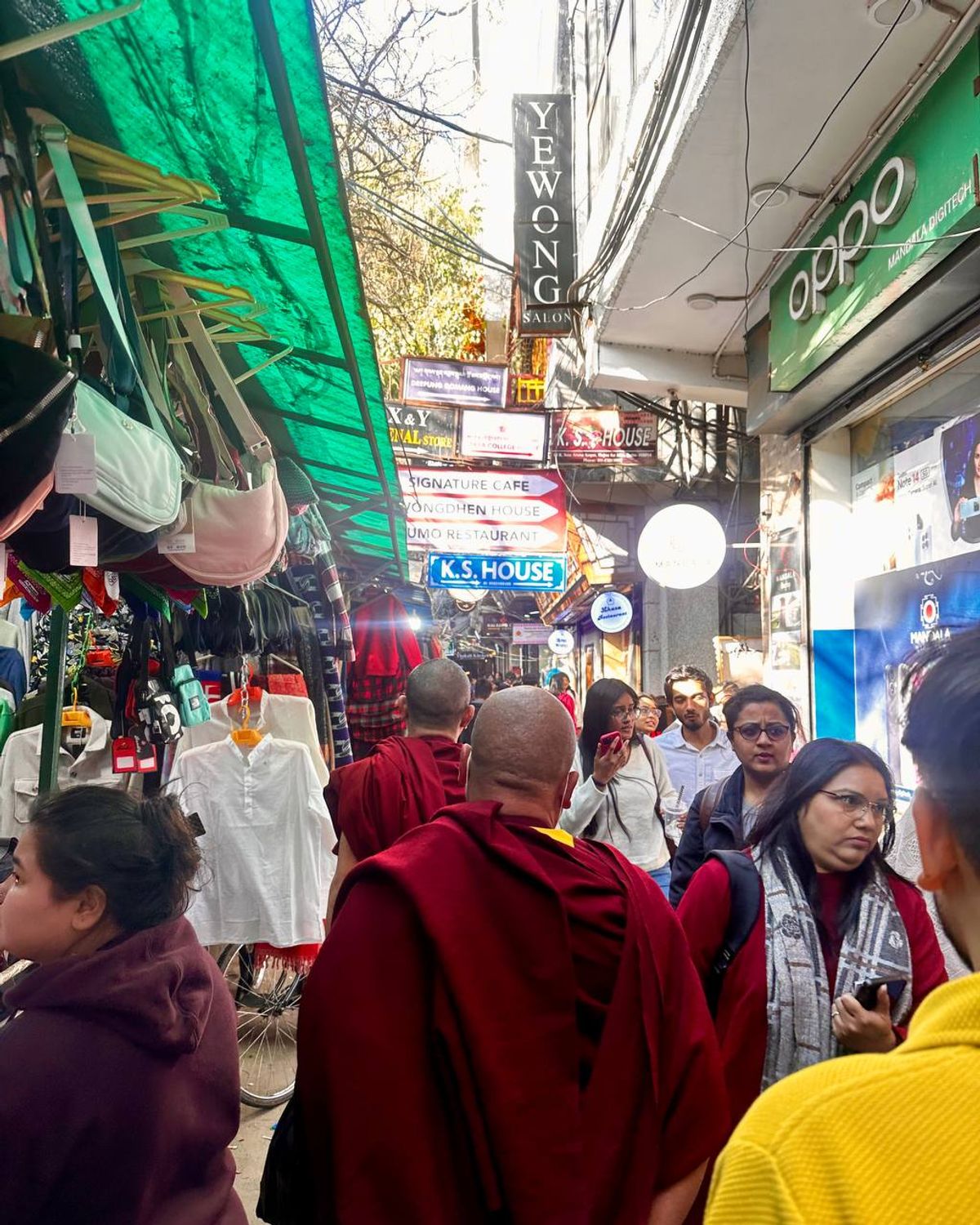 Monks and visitors crowding the narrow lanes of Majnu Ka Tilla