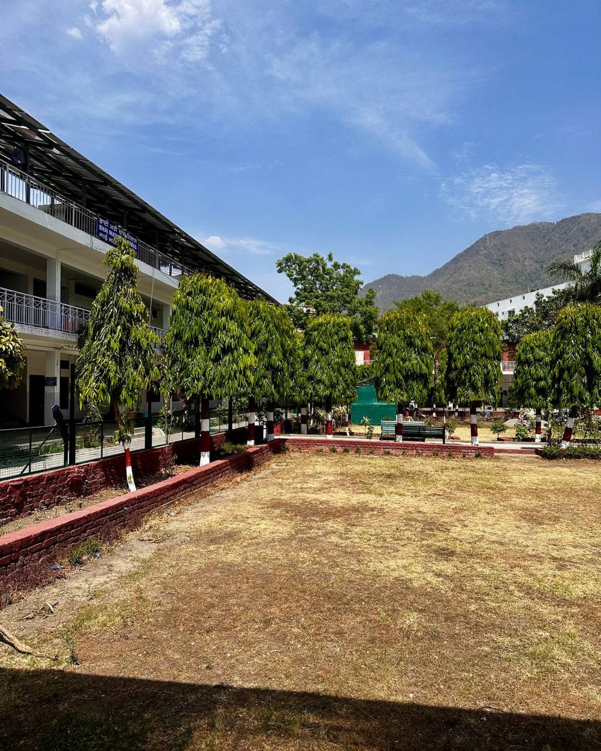 Gurdwara courtyard with mountains