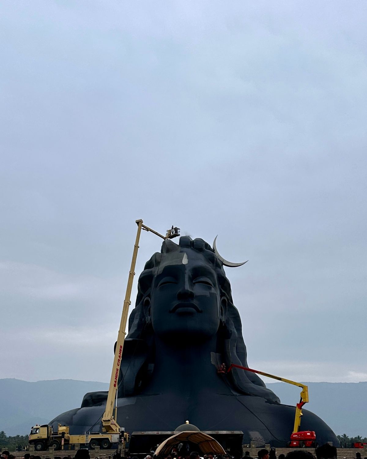 Adiyogi statue with maintenance crane showing the enormous scale