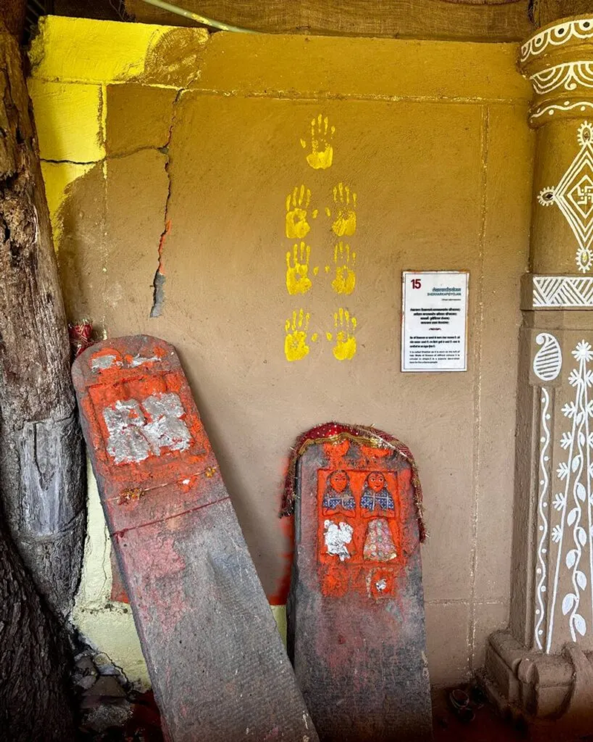 Sacred stones with vermillion and handprints