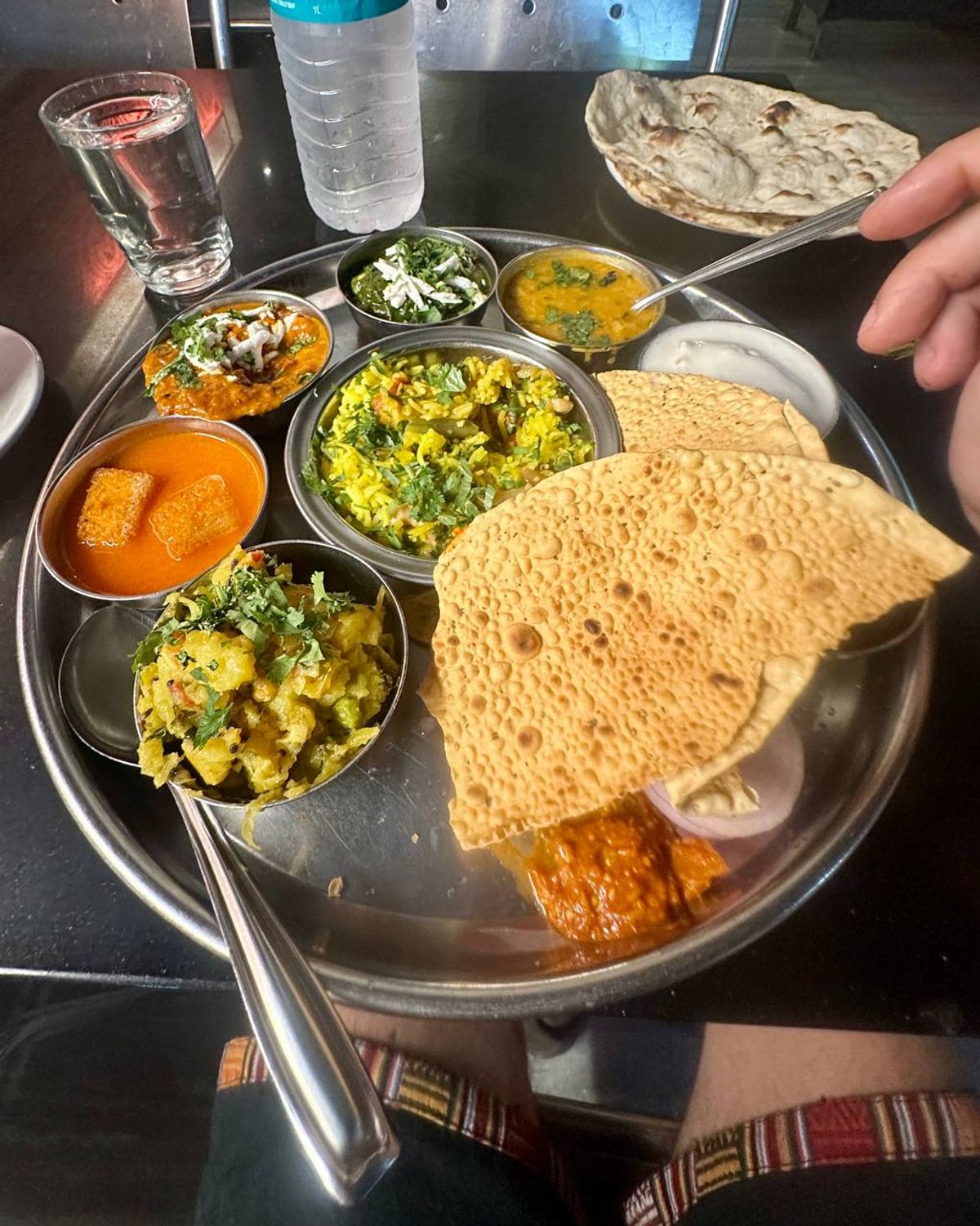 Gujarati thali with papad and multiple dishes